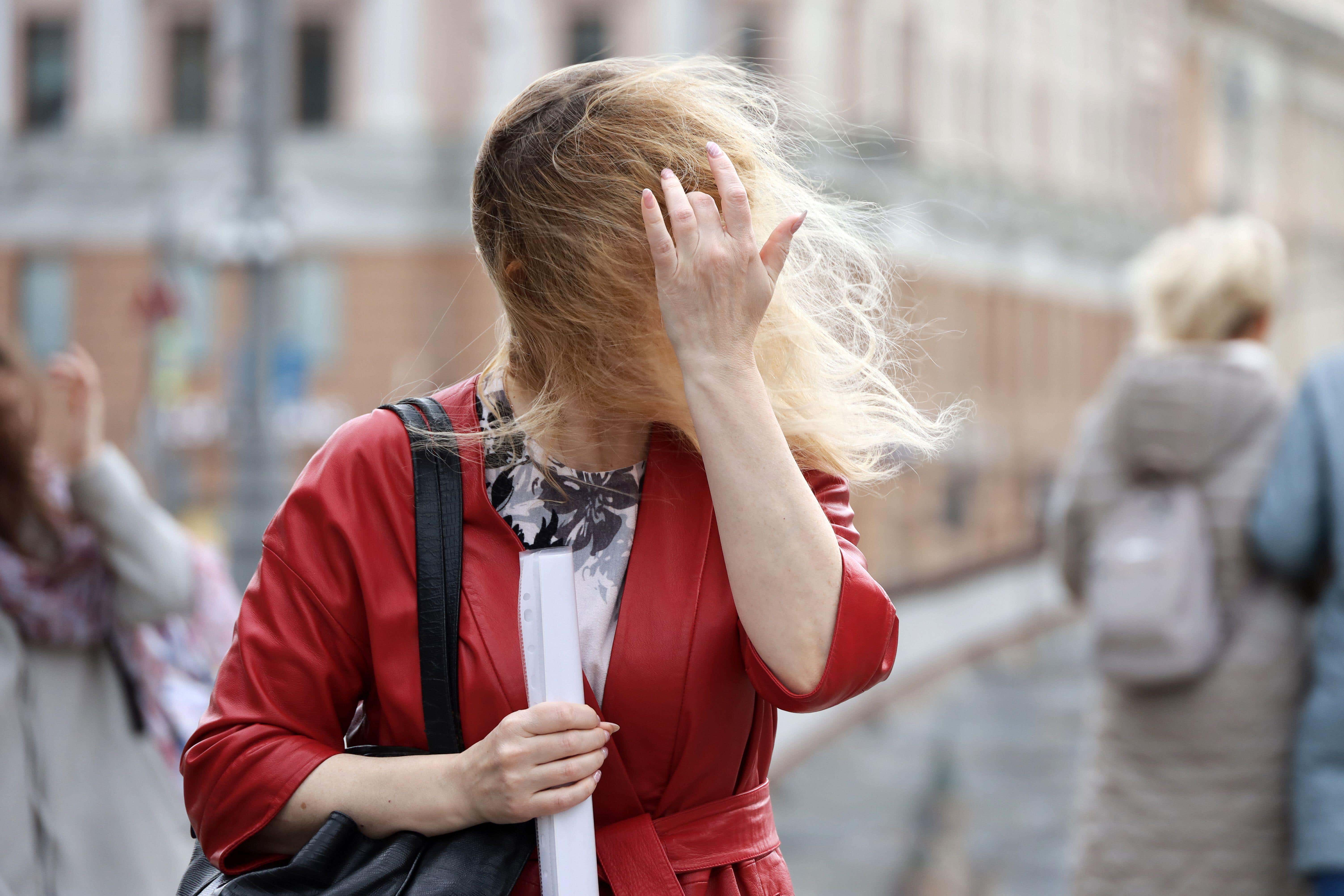 Here’s how your hair can combat the wet and windy weather (Alamy/PA)