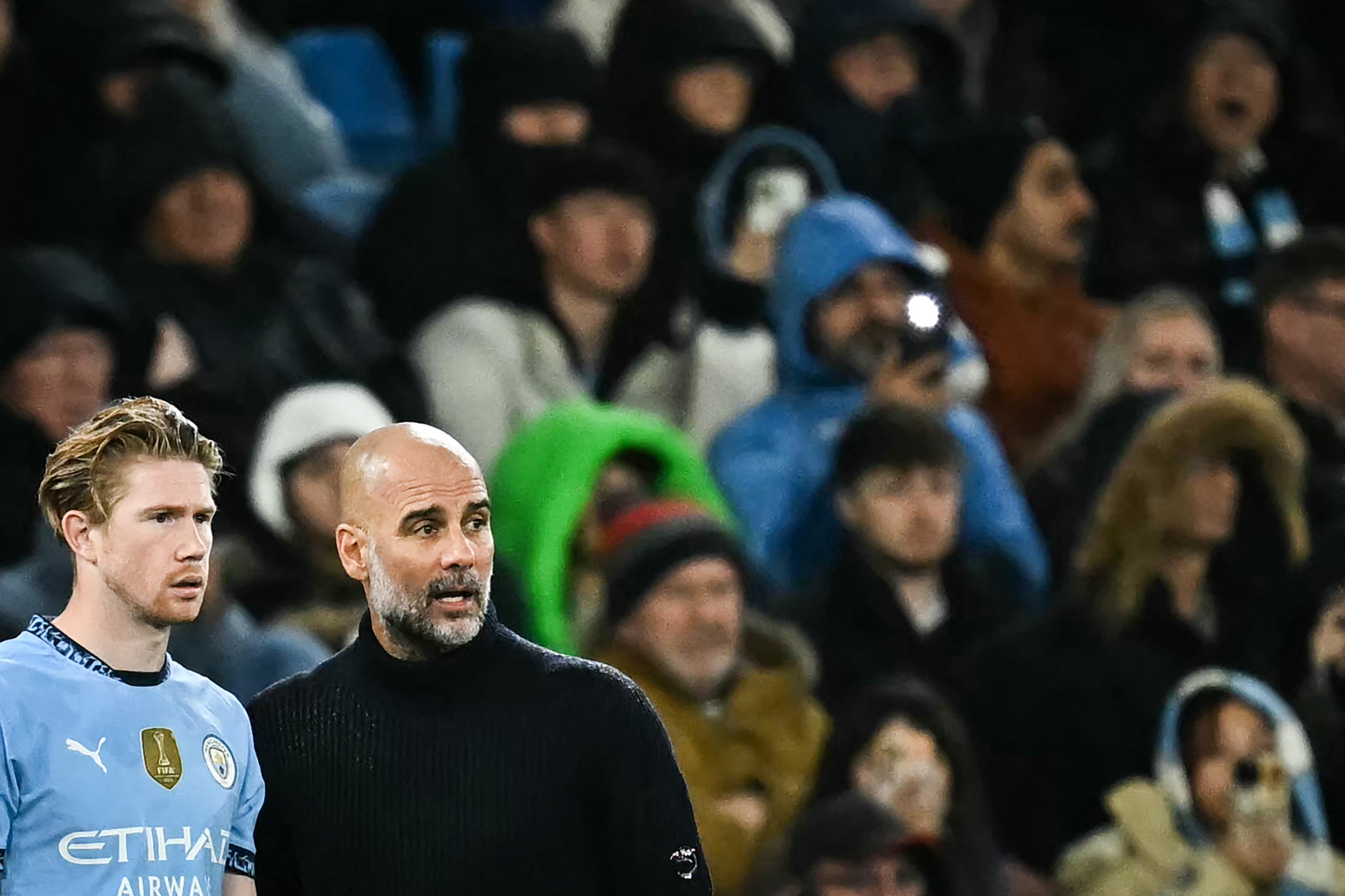 Pep Guardiola speaks to Kevin De Bruyne during Man City’s loss to Spurs