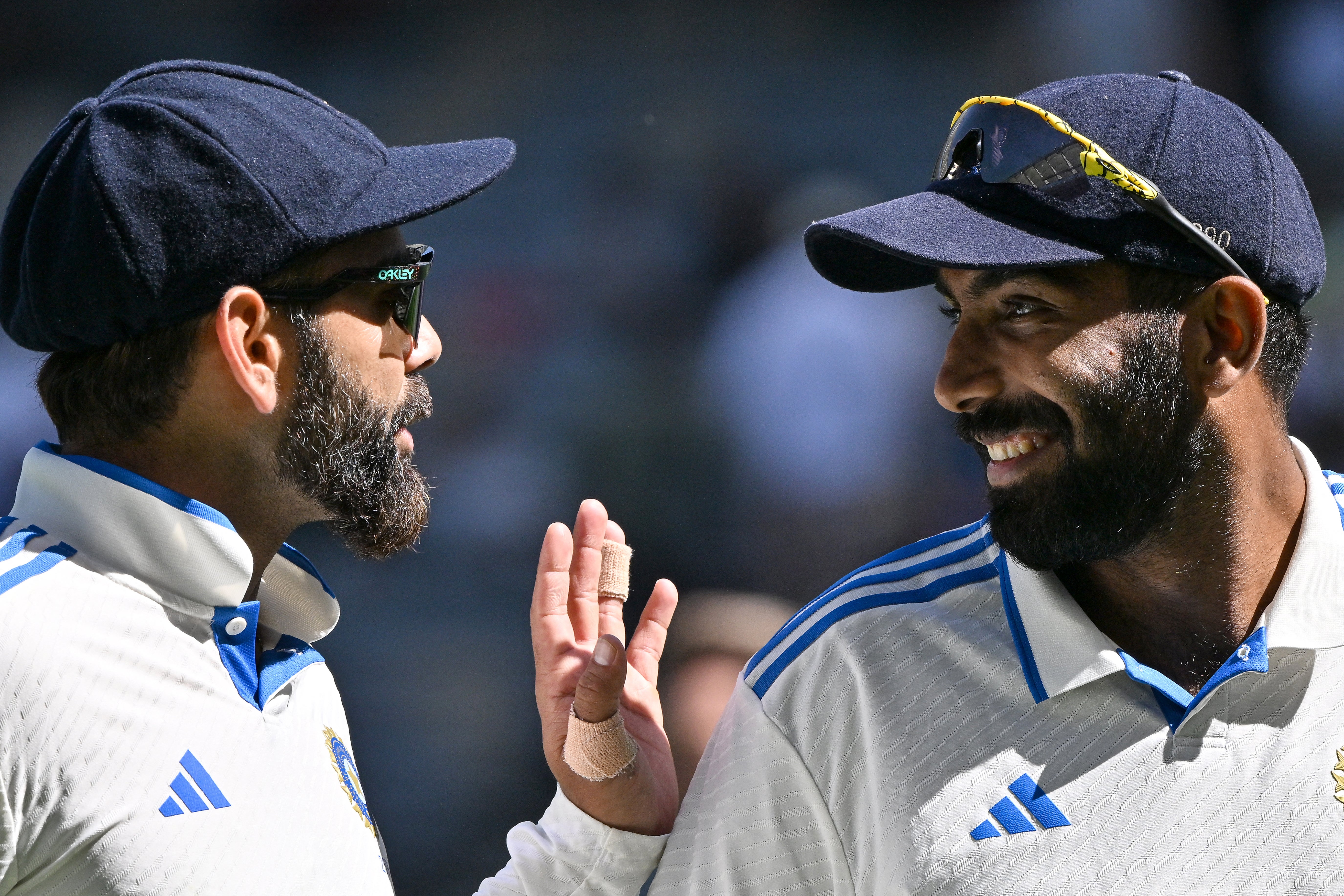 India’s skipper Jasprit Bumrah and Virat Kohli chat at Optus Stadium in Perth