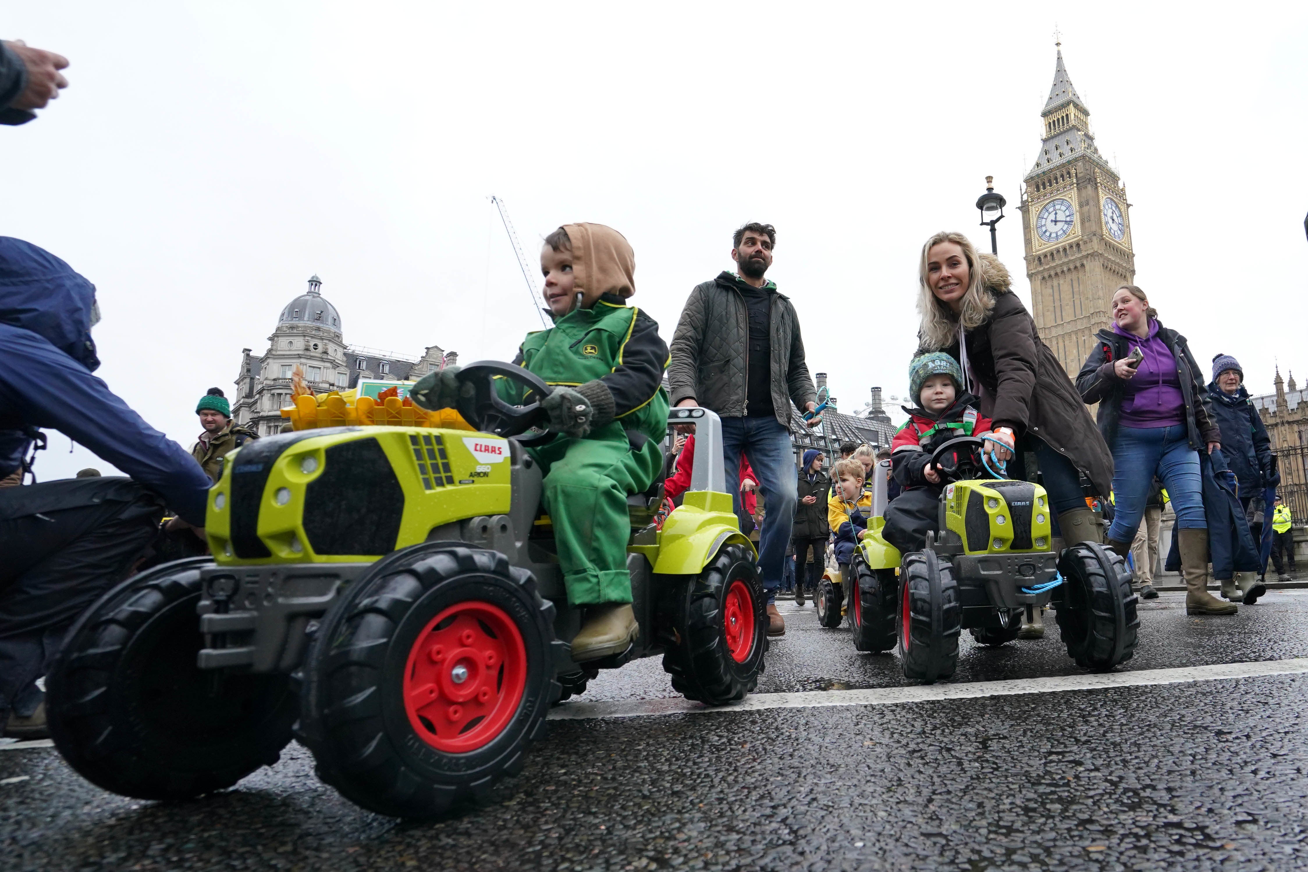 Children on toy tractors during a farmers protest in central London over the changes to inheritance tax (Gareth Fuller/PA)