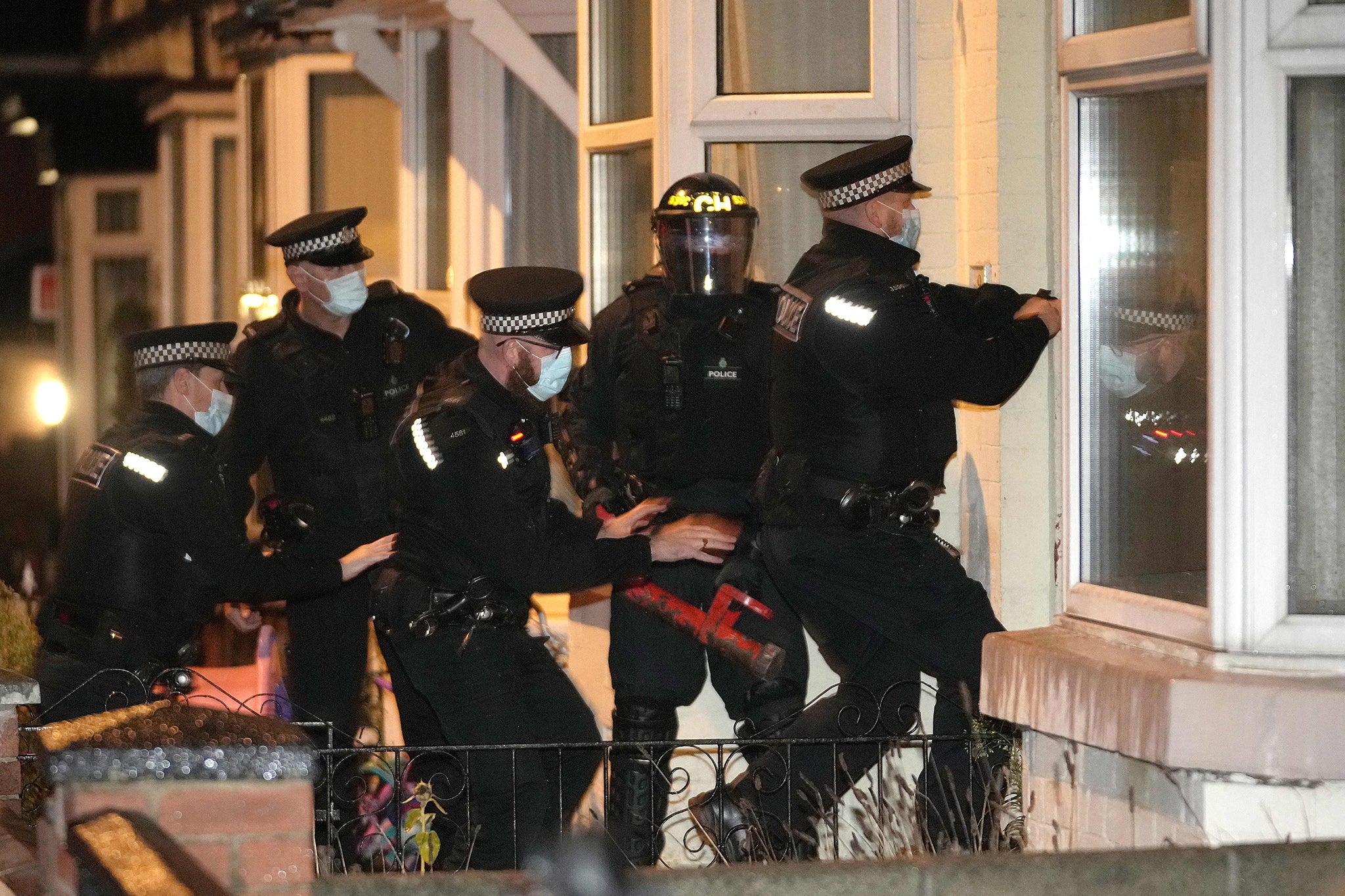 Merseyside Police raiding a home in Liverpool in 2021