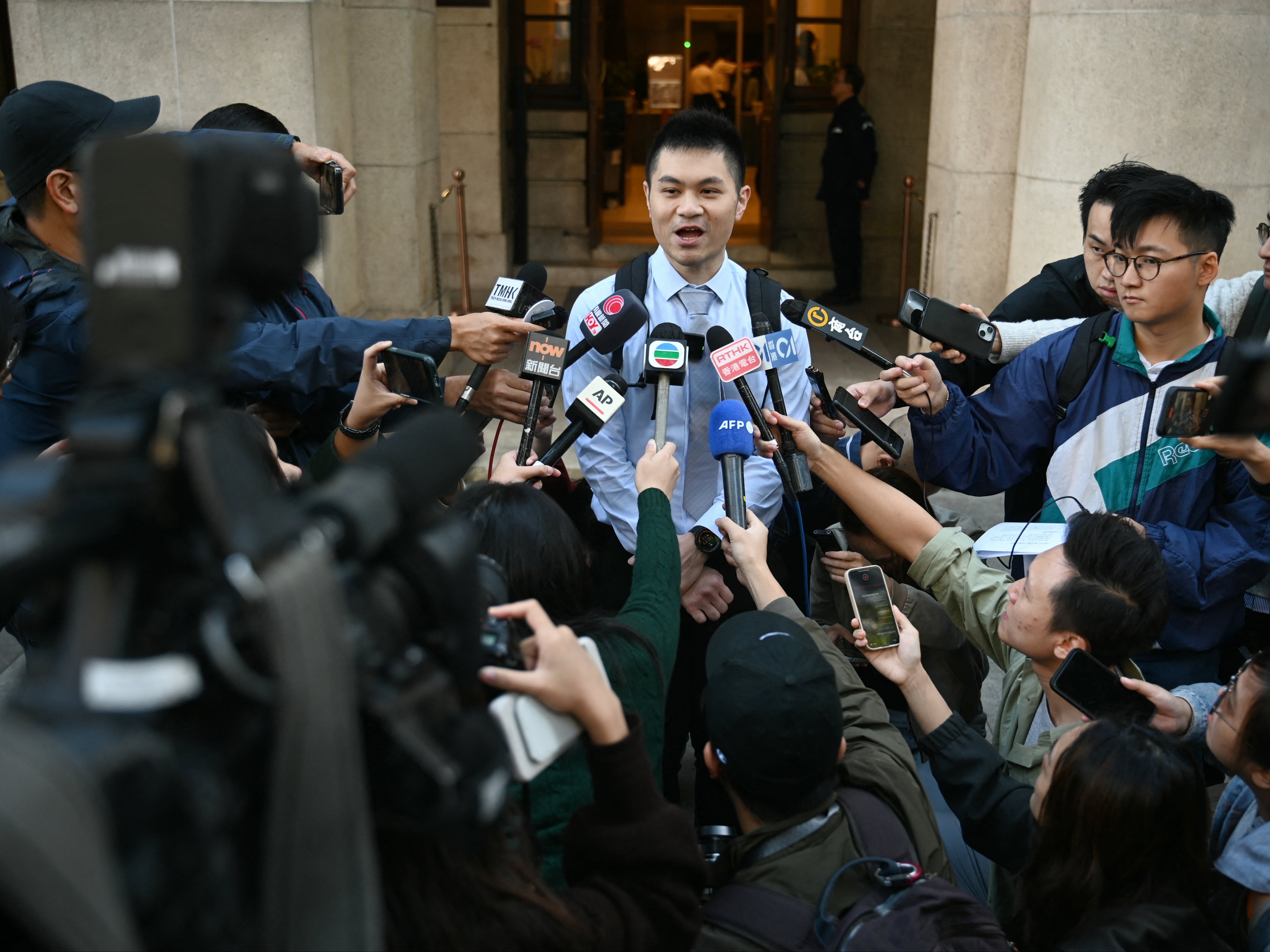 Plaintiff Nick Infinger speaks to the media about the latest ruling on same-sex couples outside the Court of Final Appeal in Hong Kong on November 26, 2024. Hong Kong’s top court ruled on 26 November to affirm housing and inheritance entitlements for same-sex couples, siding against the government in favour of LGBTQ rights protection