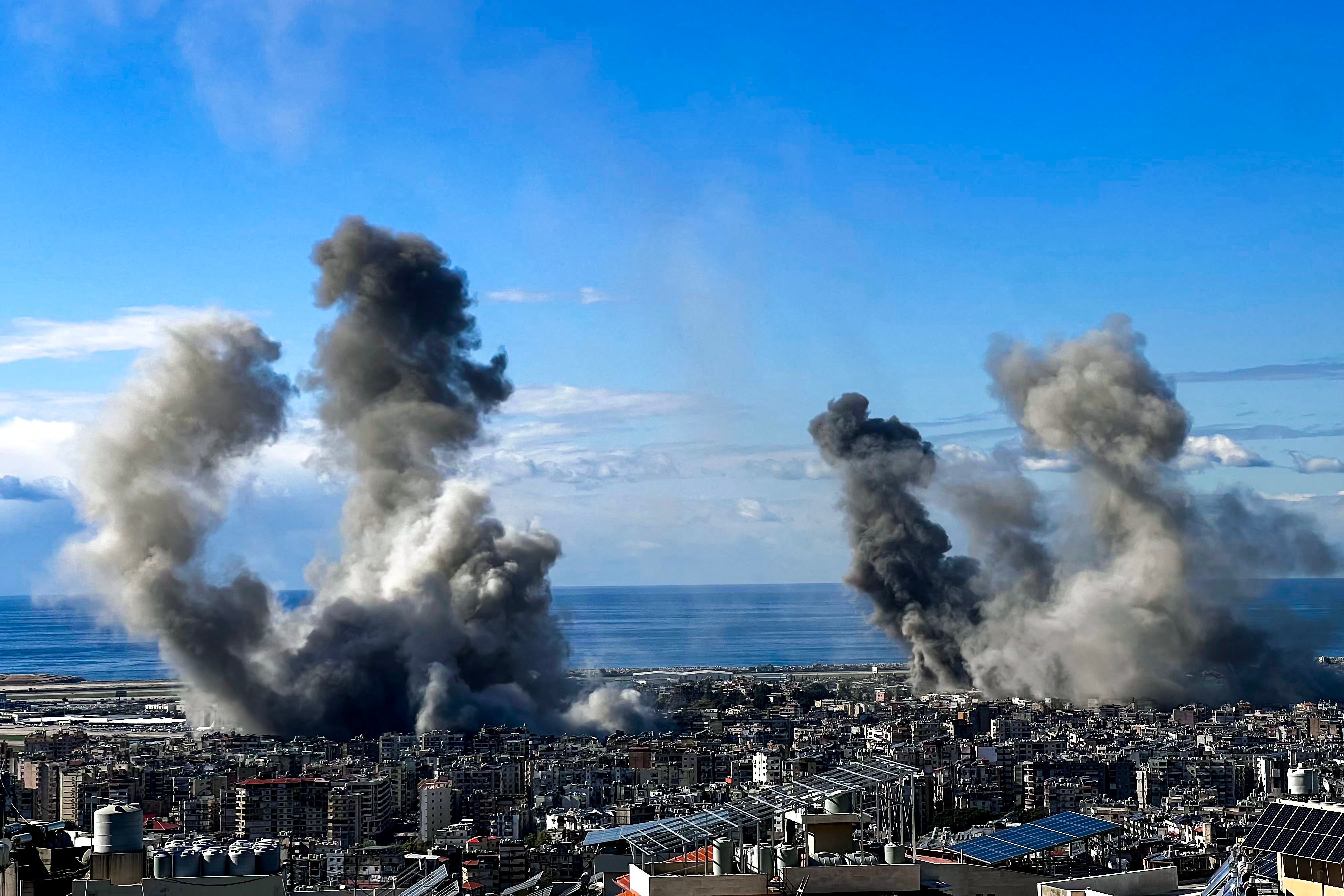 Smoke rises from the site of Israeli airstrikes in southern Beirut this morning