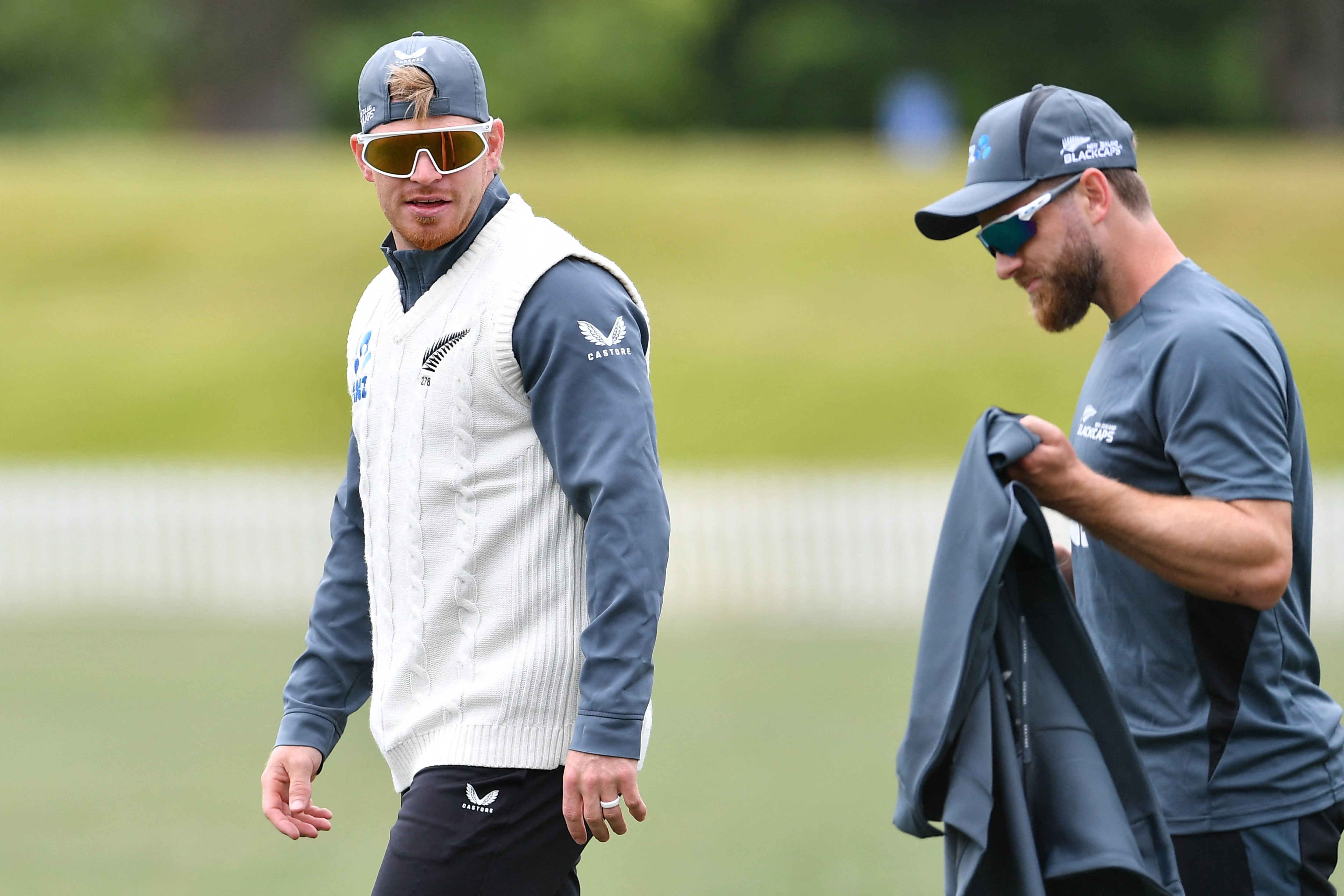 New Zealand’s Glenn Phillips talks with his teammate Kane Williamson