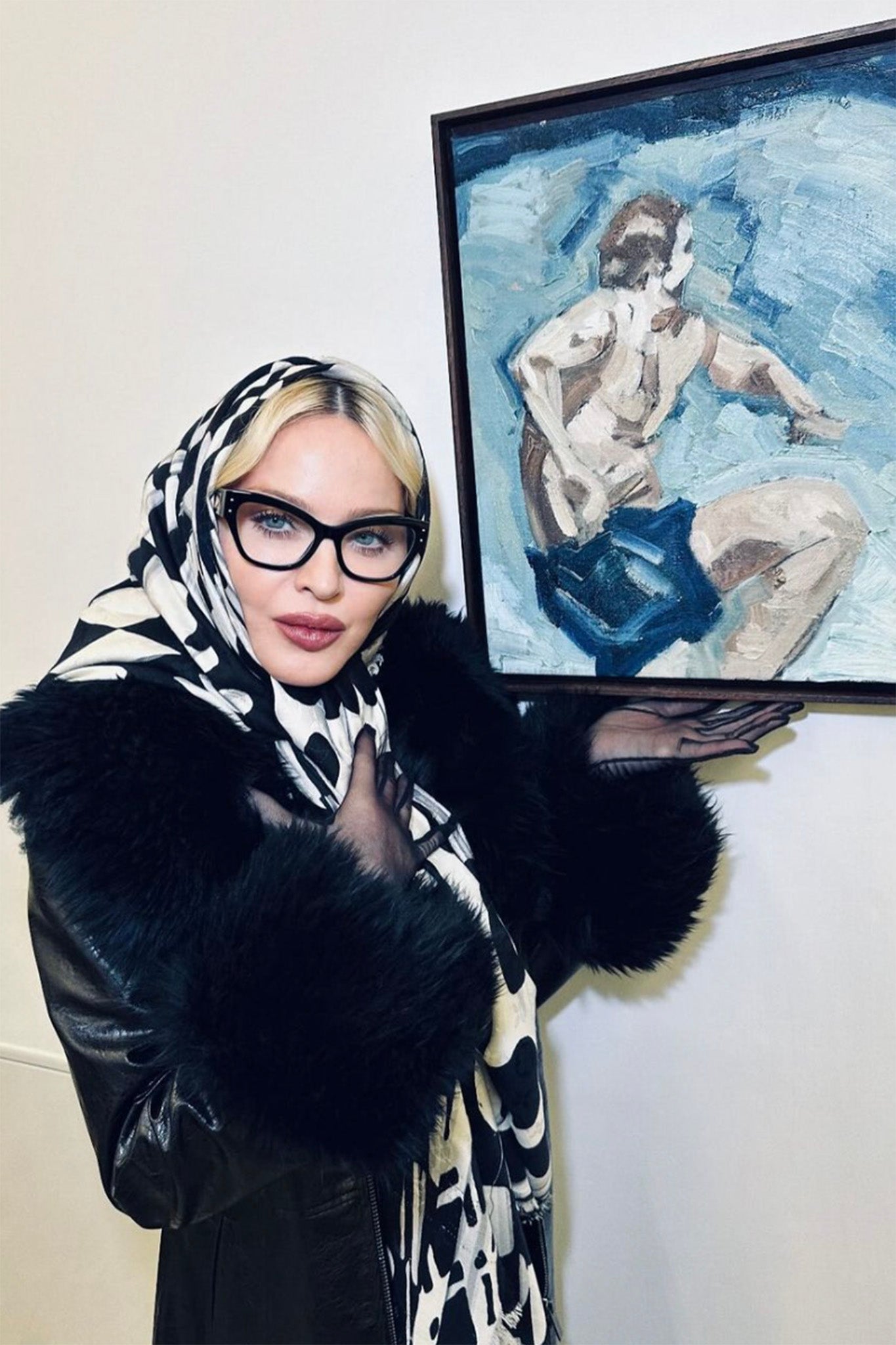 Madonna wears a Charlotte Simone coat at her son Rocco’s art exhibition in Paris