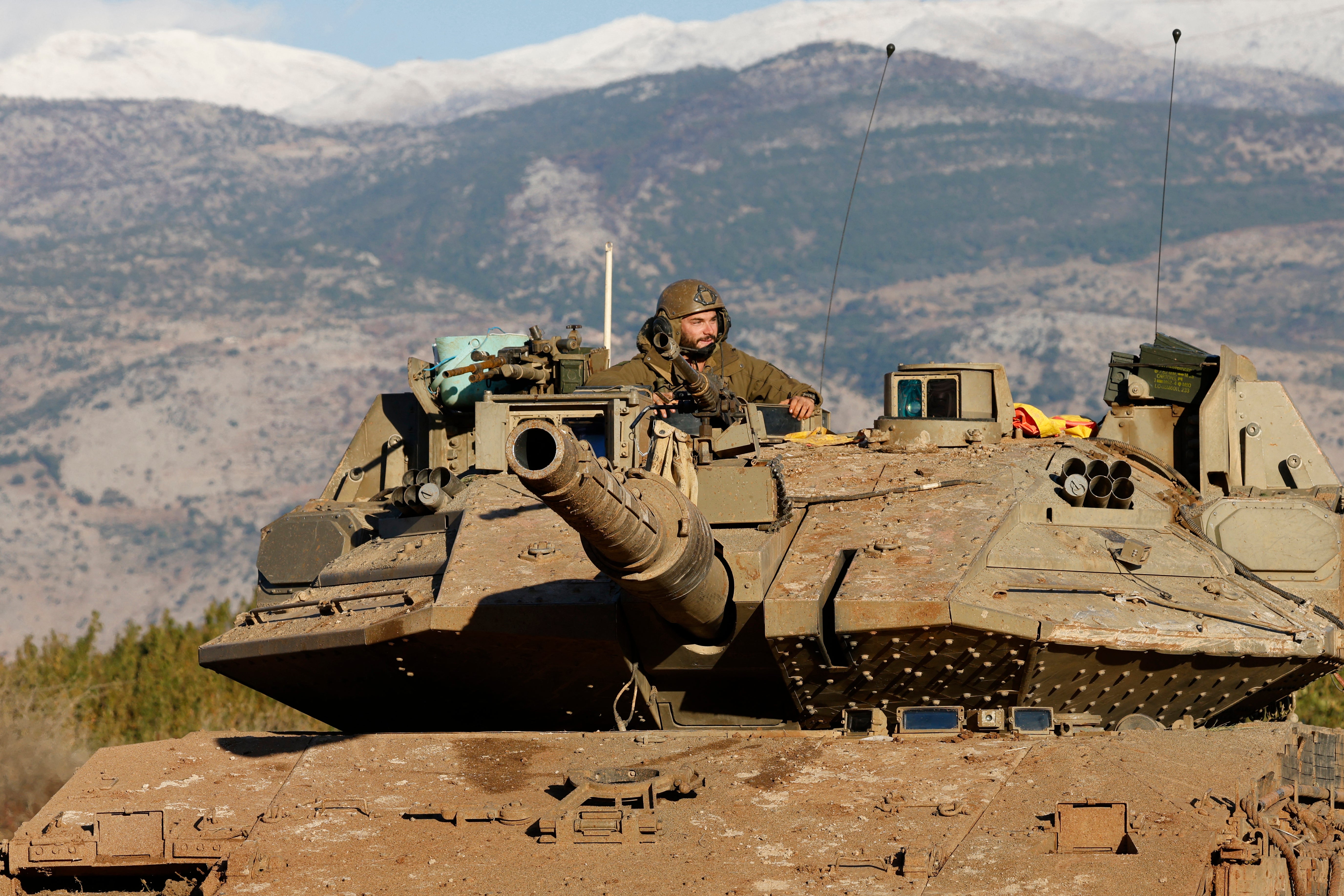 An Israeli tank stationed near the border with Lebanon in the Upper Galilee area in northern Israel on Tuesday