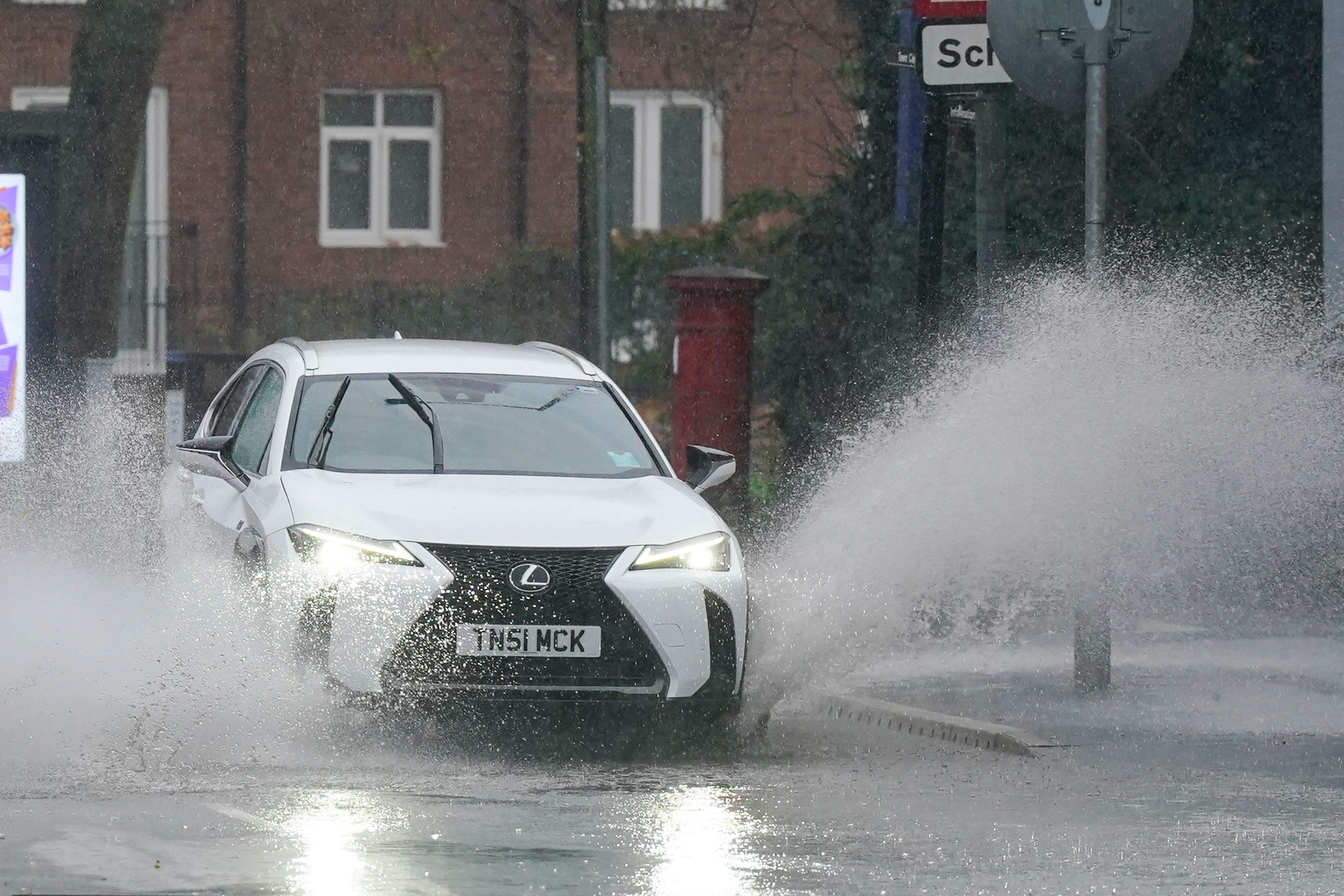 A vehicle is driven through floodwater after heavy rain in Warwick, more than 200 flood alerts are in place in the UK as Storm Bert continues to sweep across the country. Picture date: Sunday November 24, 2024.