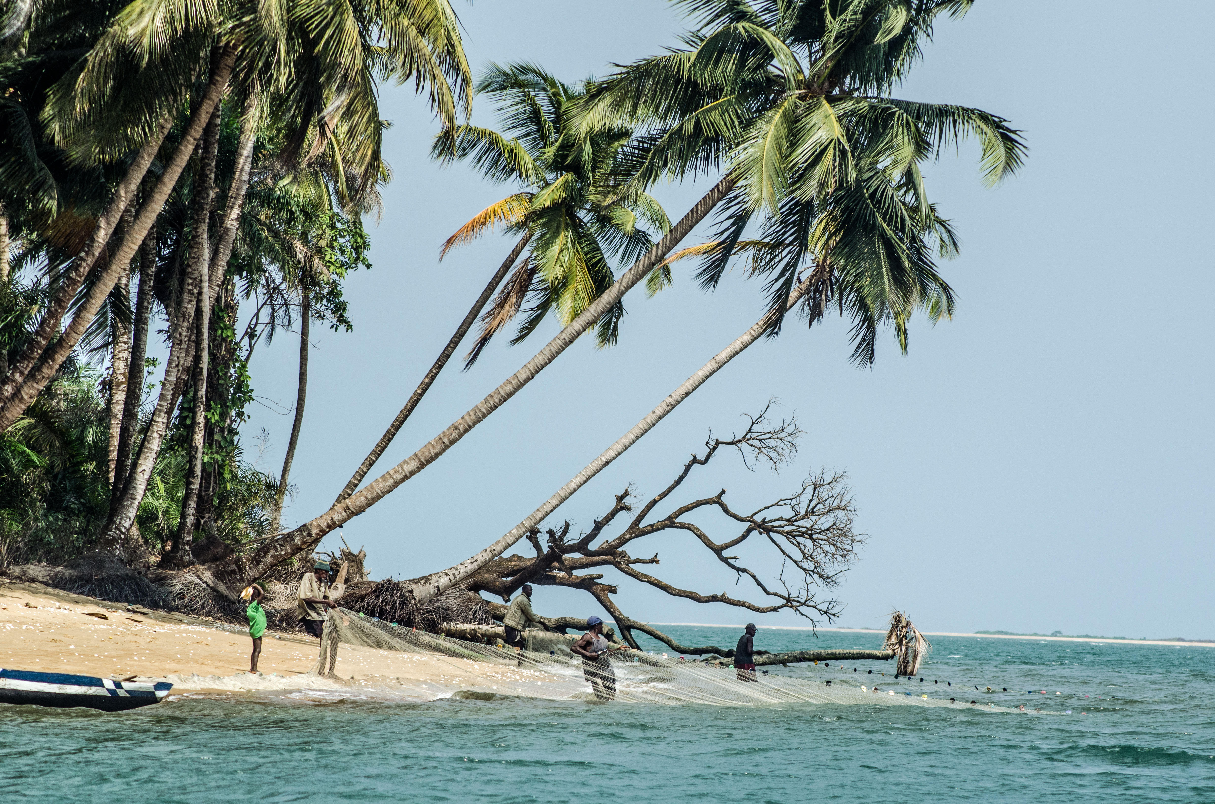 Fishermen on a beach in the Turtle Islands