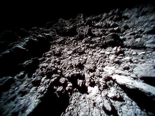 Image captured by Rover-1B, and provided by the Japan Aerospace Exploration Agency (JAXA) shows the surface of asteroid Ryugu