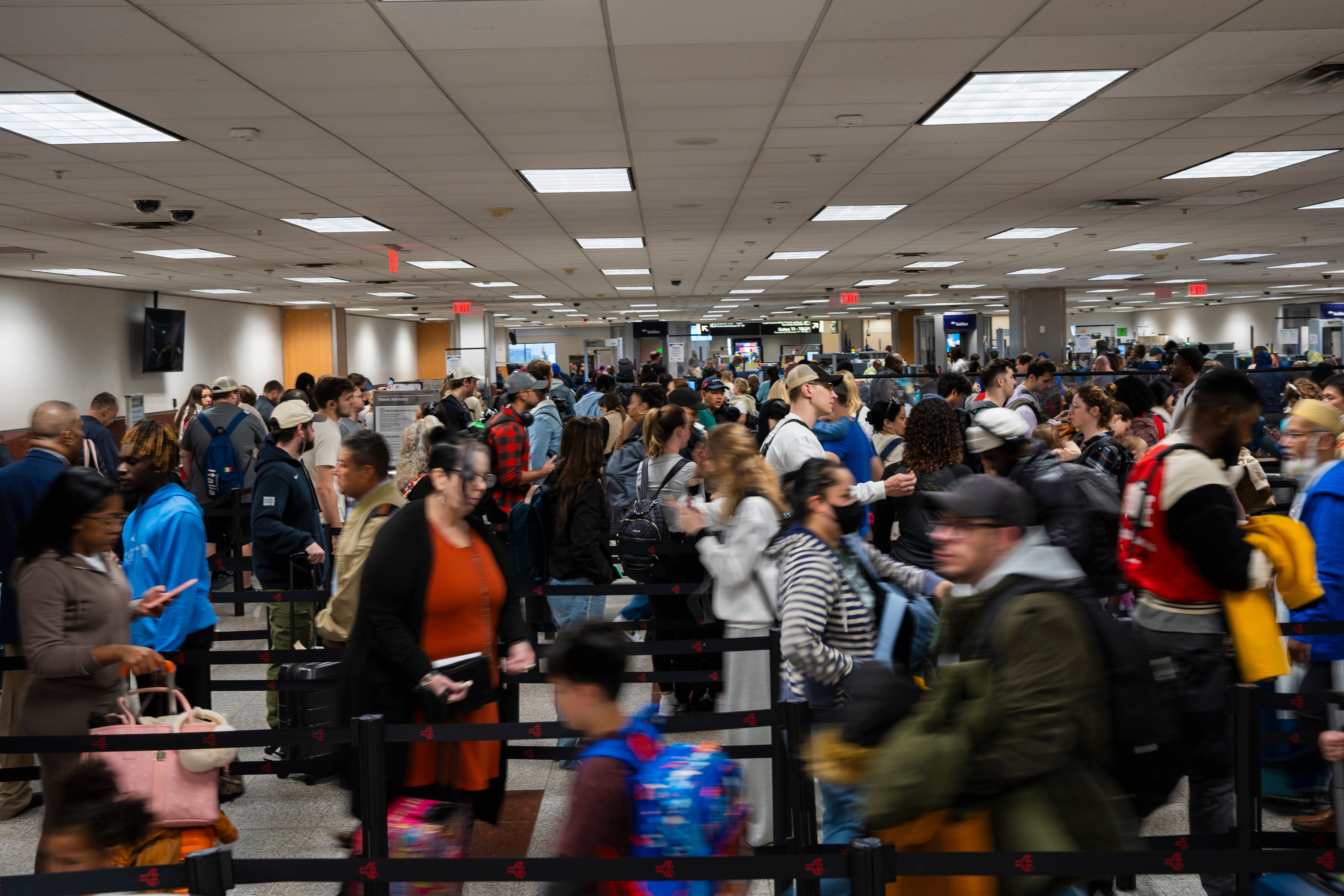 Travelers rush to their gate at Hartsfield-Jackson Atlanta International Airport on Tuesday in Georgia. Millions of people are expected to travel during the holiday through airports