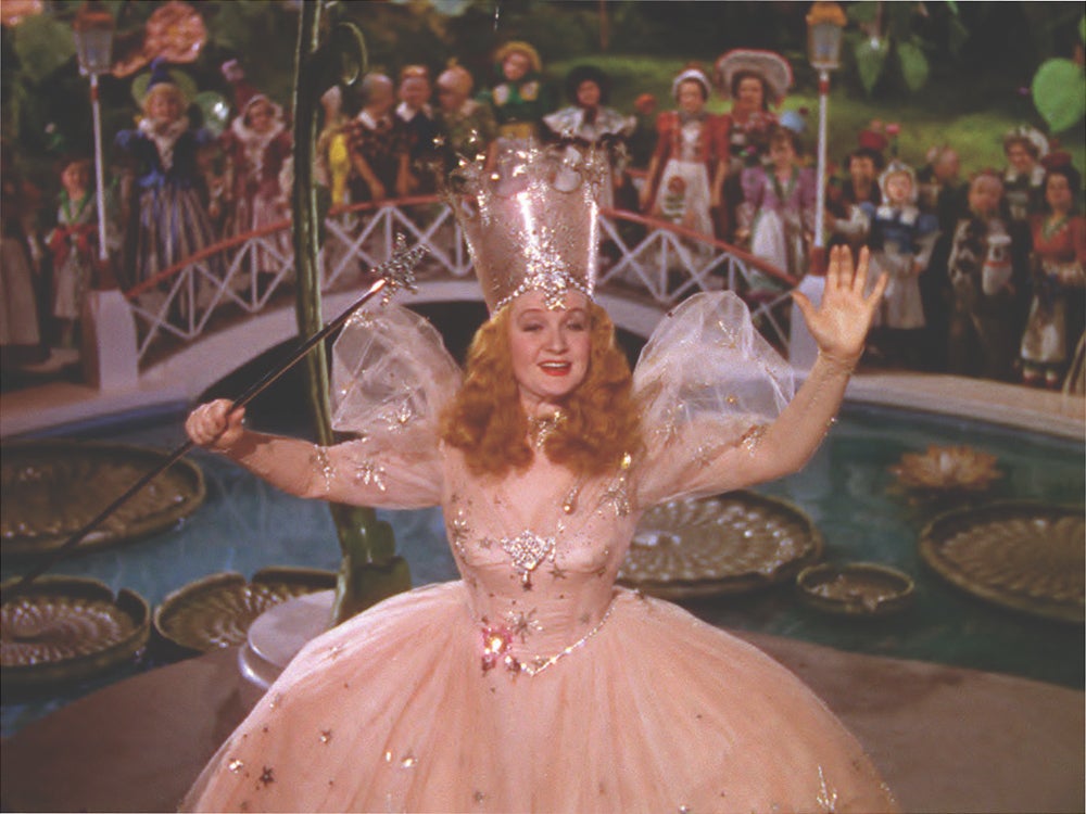 Glinda wears pink in the film rather than blue as in the stage adaptation