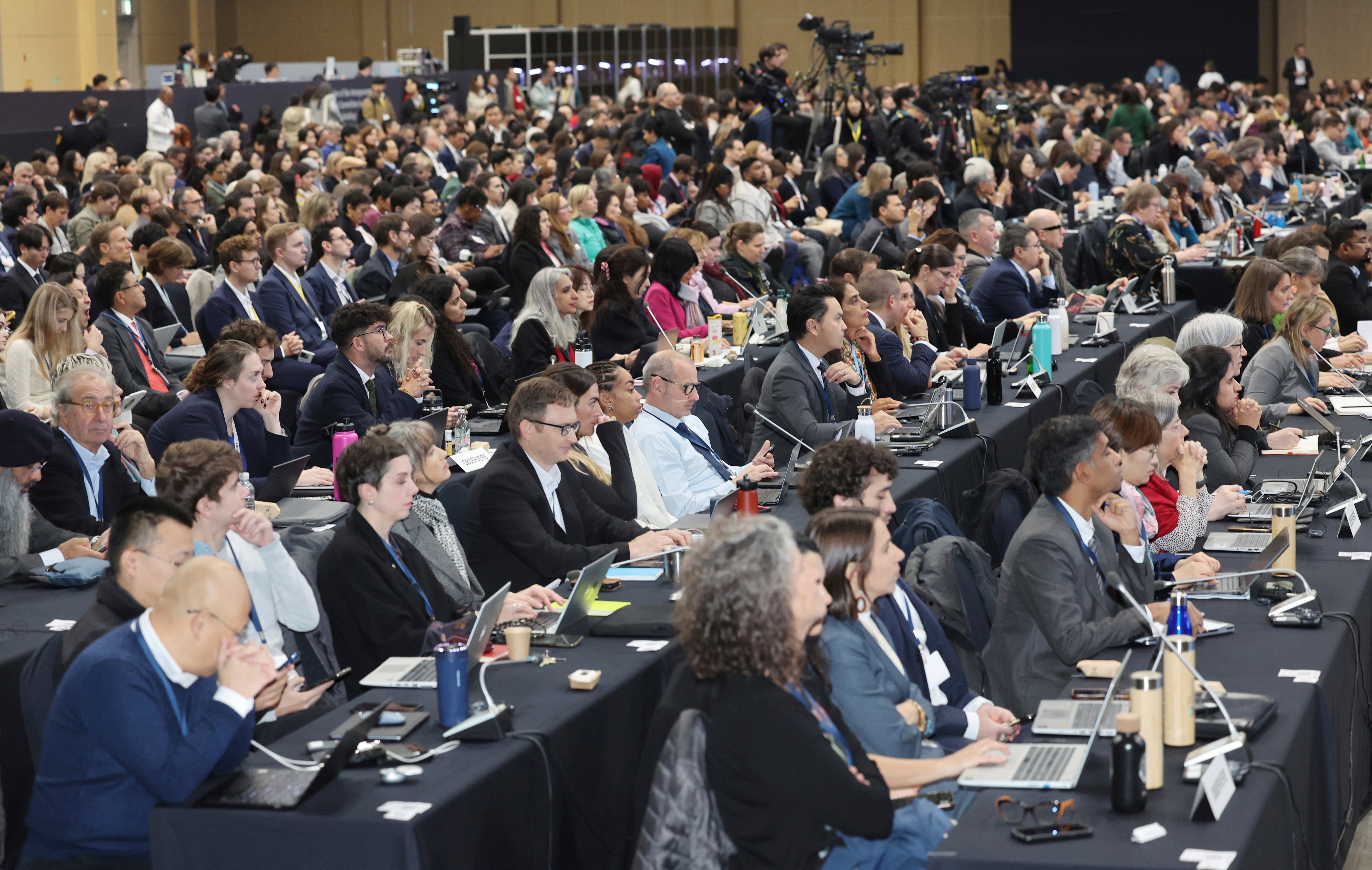 Participants attend at the opening ceremony of the fifth session of the Intergovernmental Negotiating Committee on Plastic Pollution in Busan, South Korea