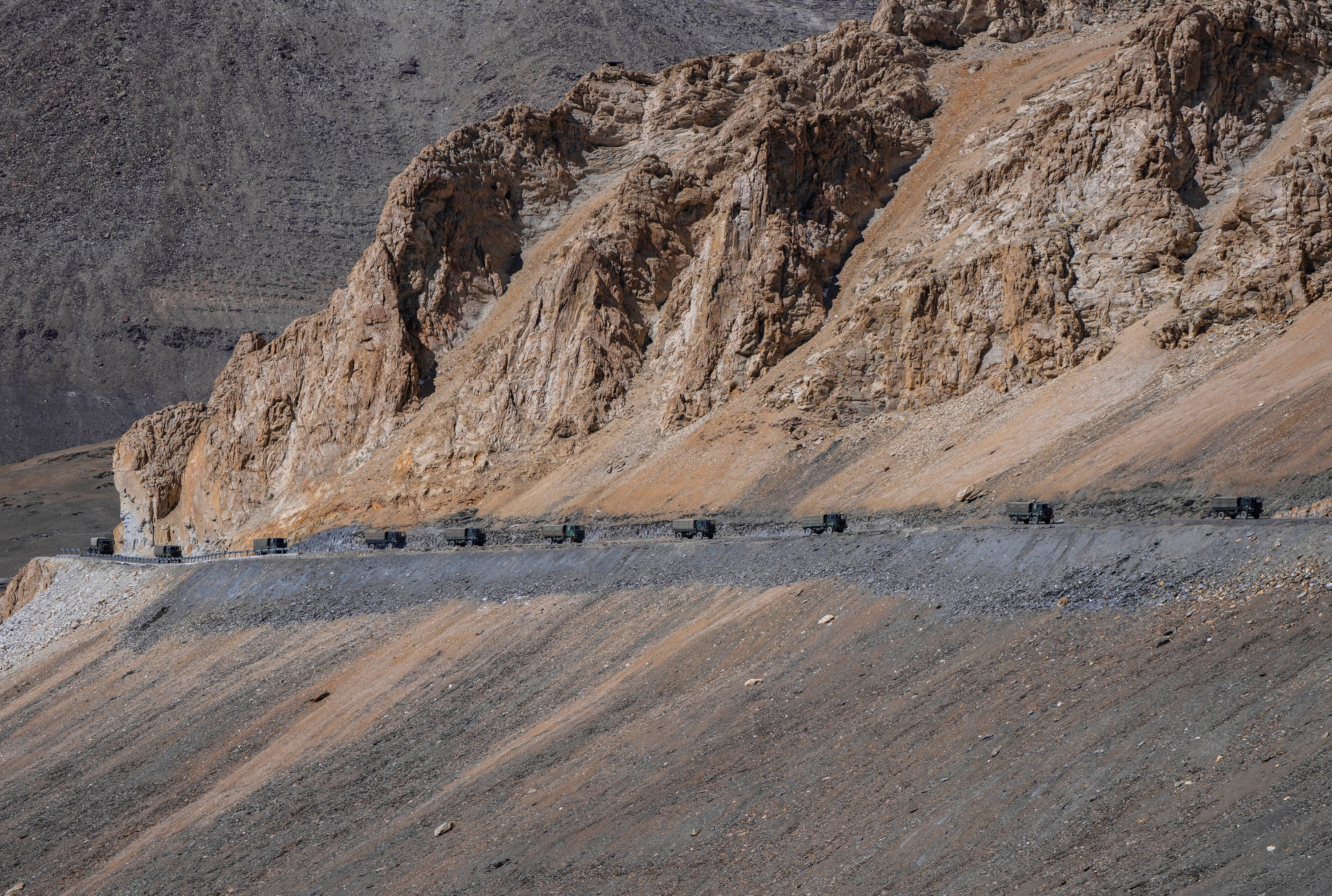 Indian army vehicles move in a convoy in the cold desert region of Ladakh on 18 September2022