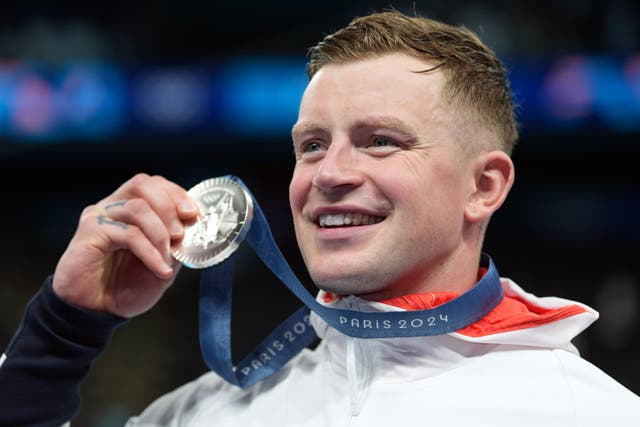 <p>Adam Peaty with his silver medal in Paris (Martin Rickett/PA)</p>