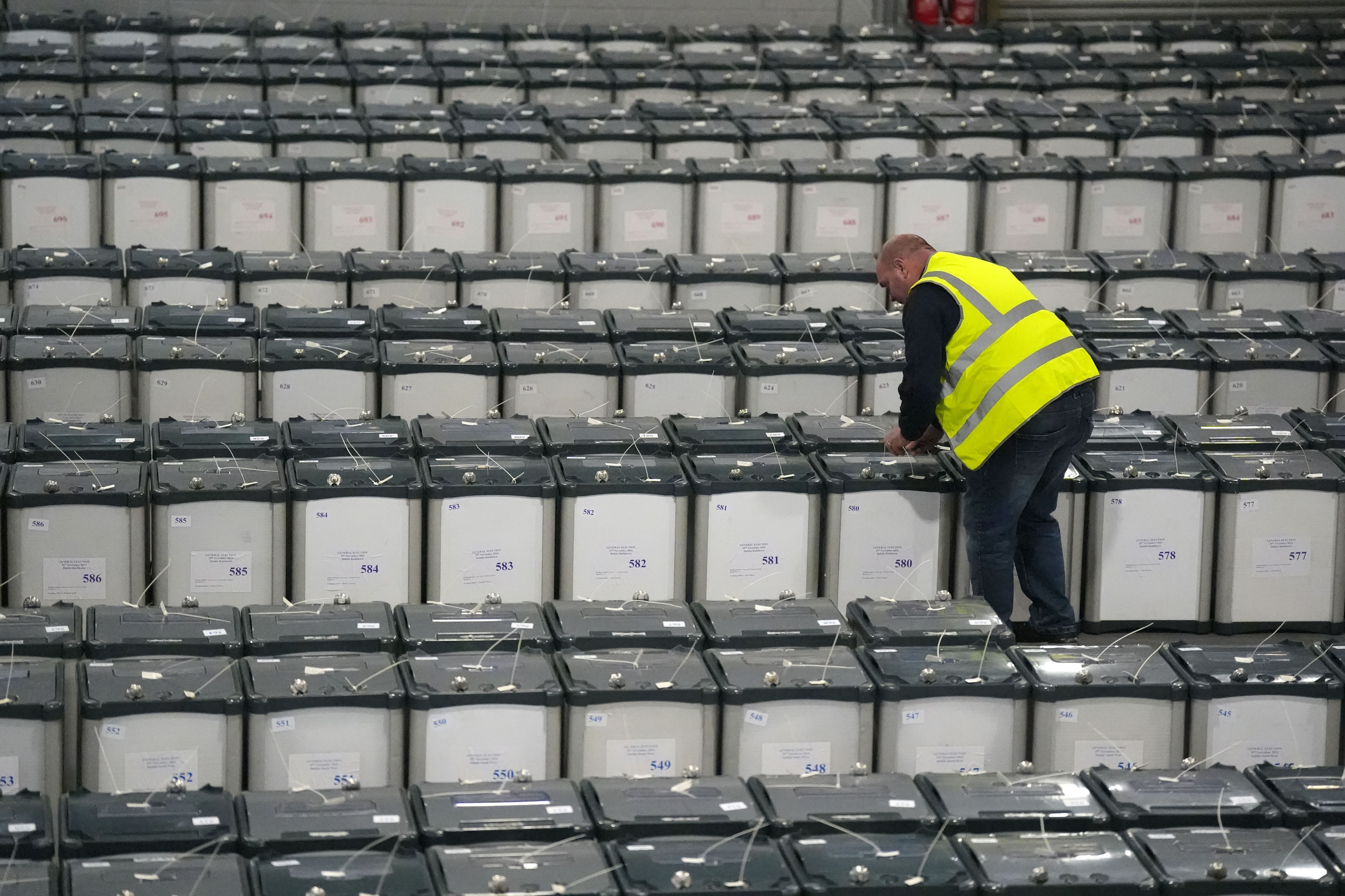 Michael Lennard sealing ballot boxes at a secure facility in west Dublin (Niall Carson/PA)