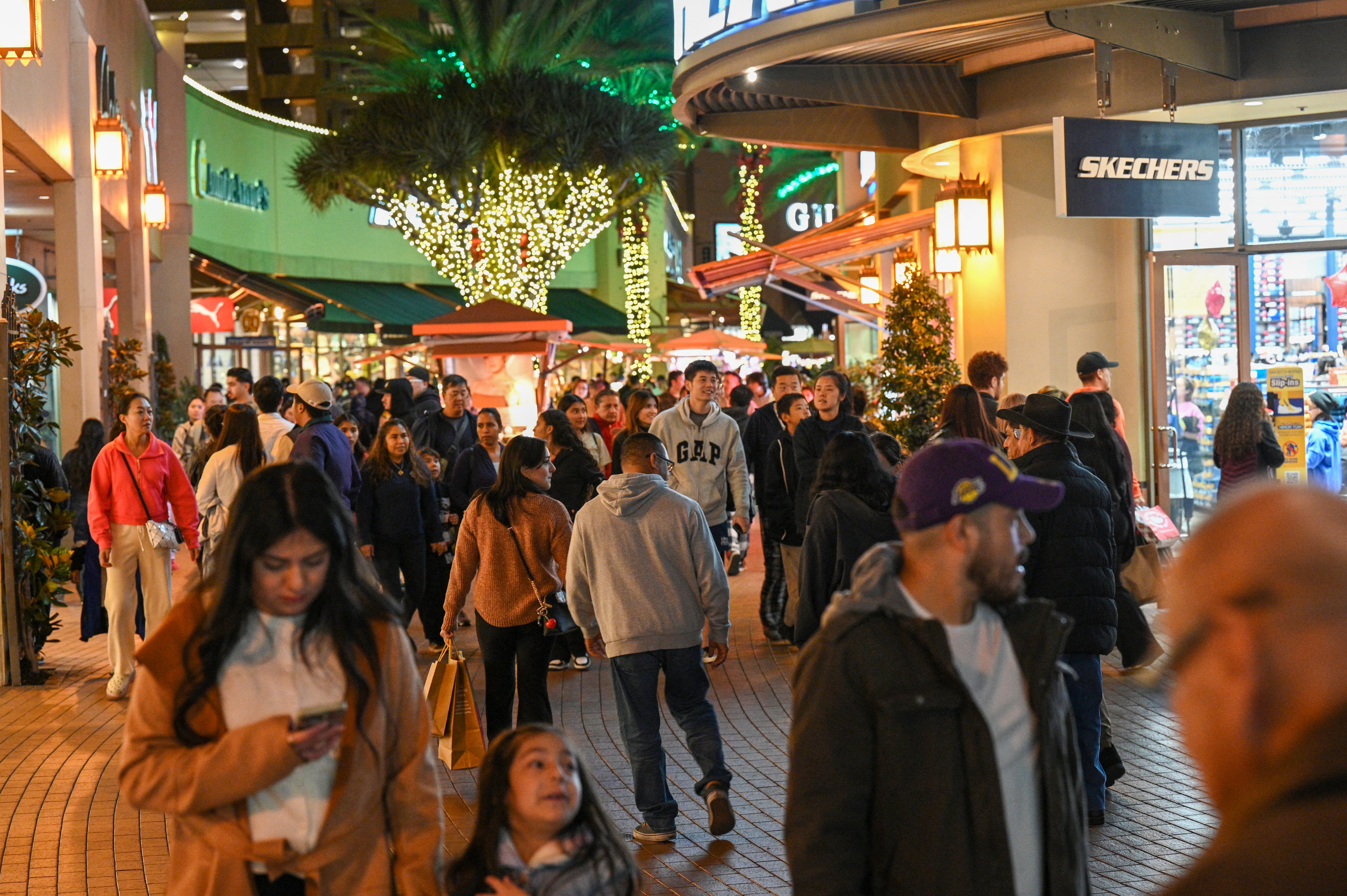 People shop early Black Friday deals on Thanksgiving Day.