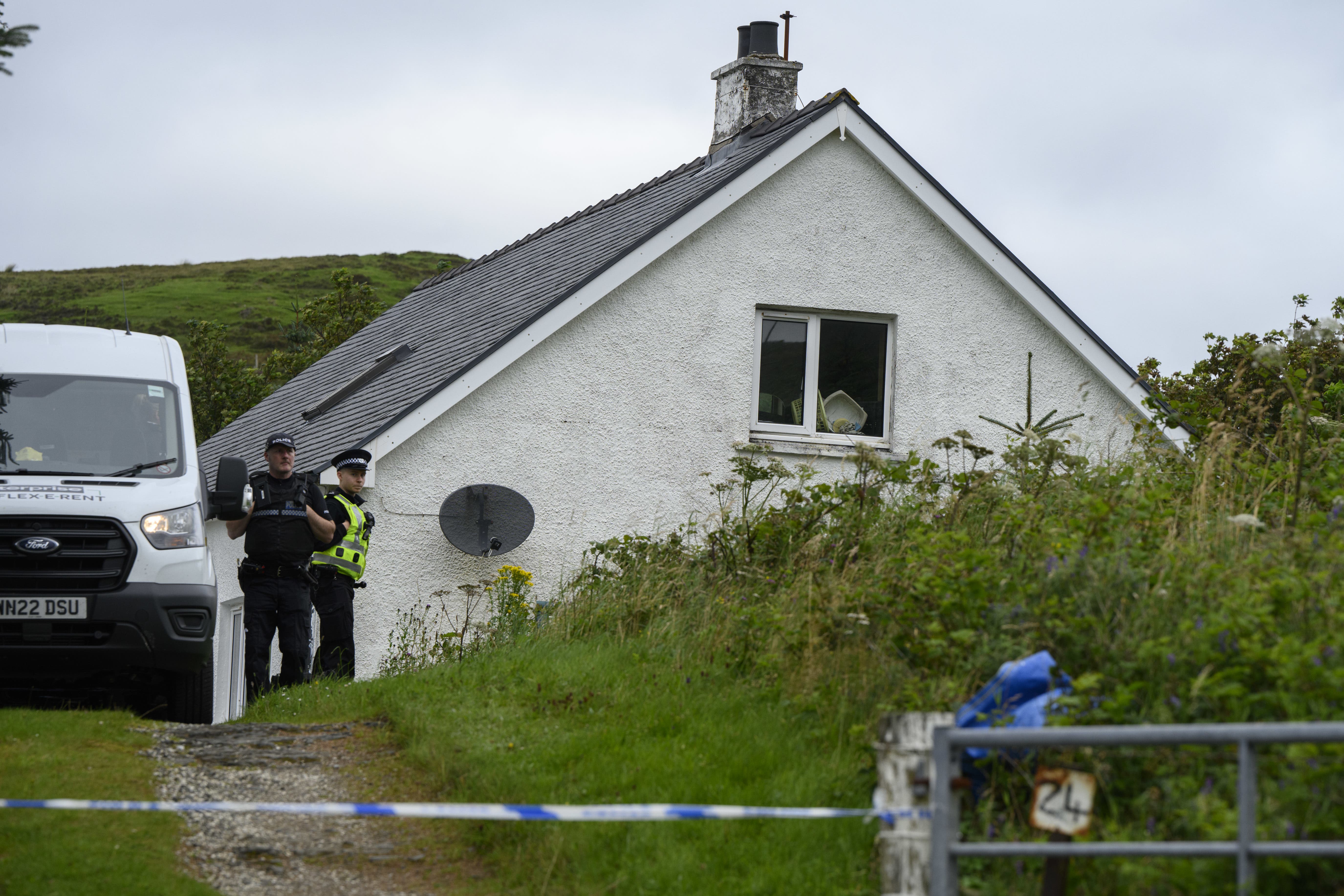 Police at the scene of one of MacDonald’s attacks in Tarskavaig on the Isle of Skye (PA)