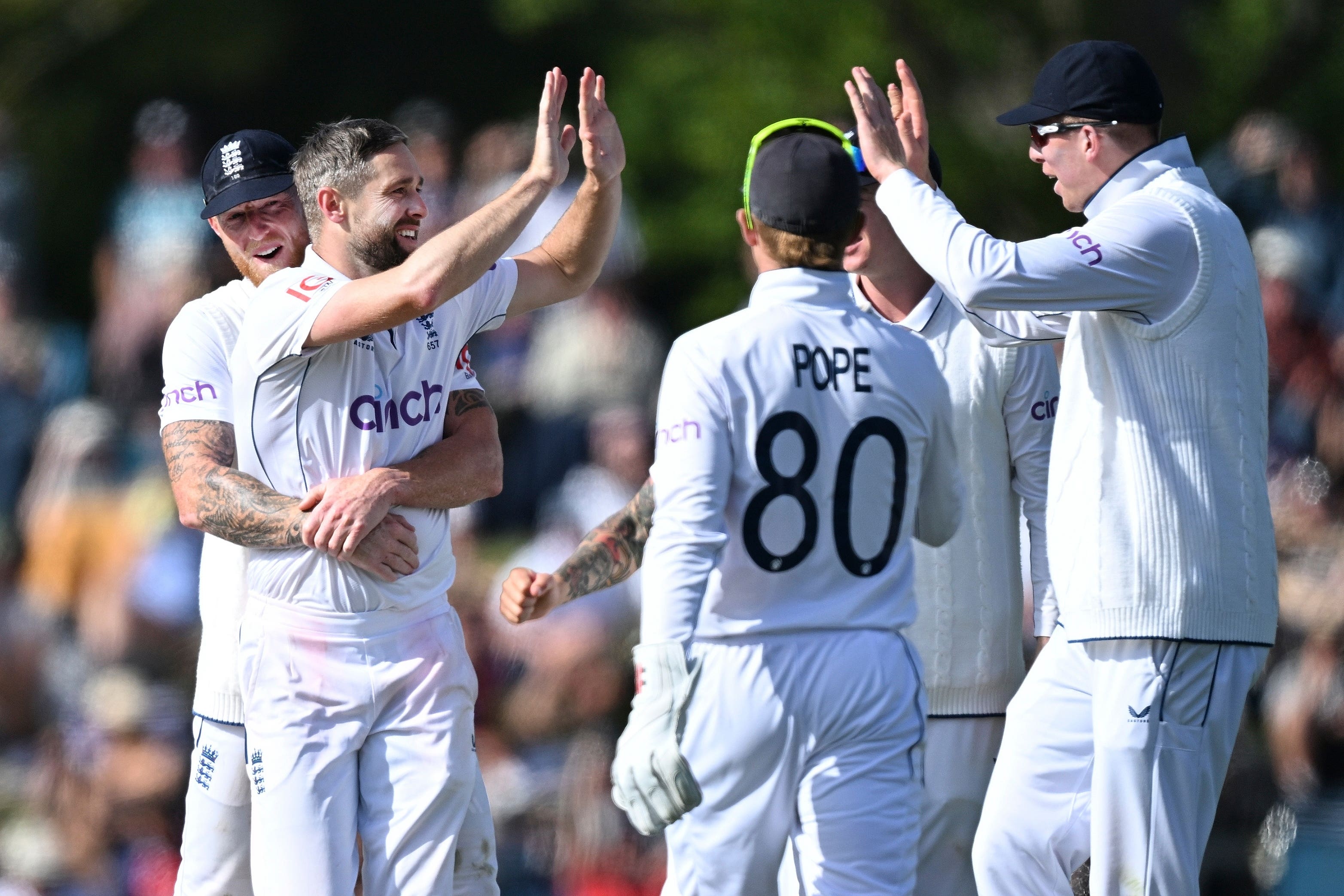 England bowler Chris Woakes, second left, celebrates with teammates after taking the wicket of New Zealand’s Kane Williamson (Andrew Cornaga/Photosport/AP)