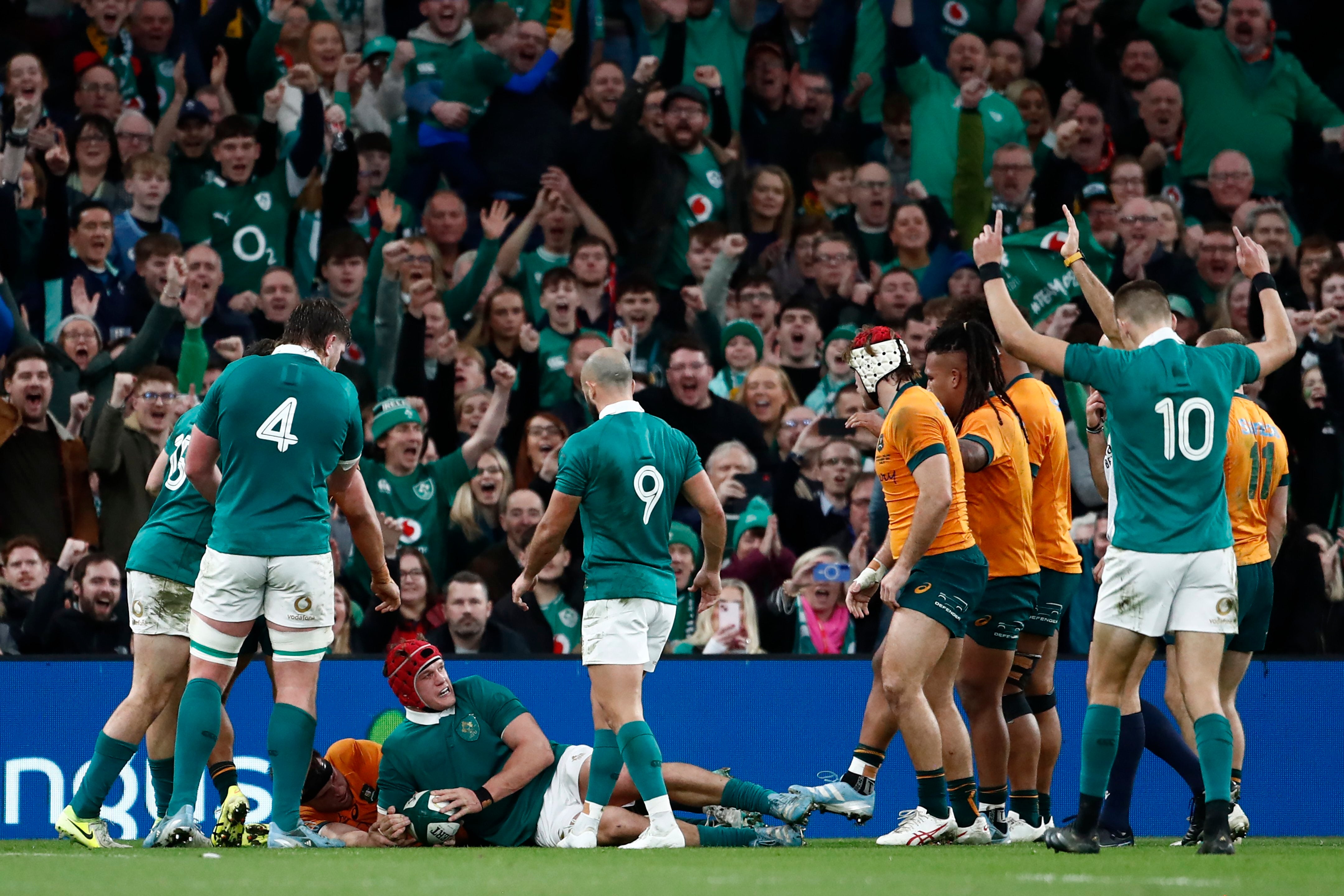 Ireland's Josh van der Flier, bottom, scores a try