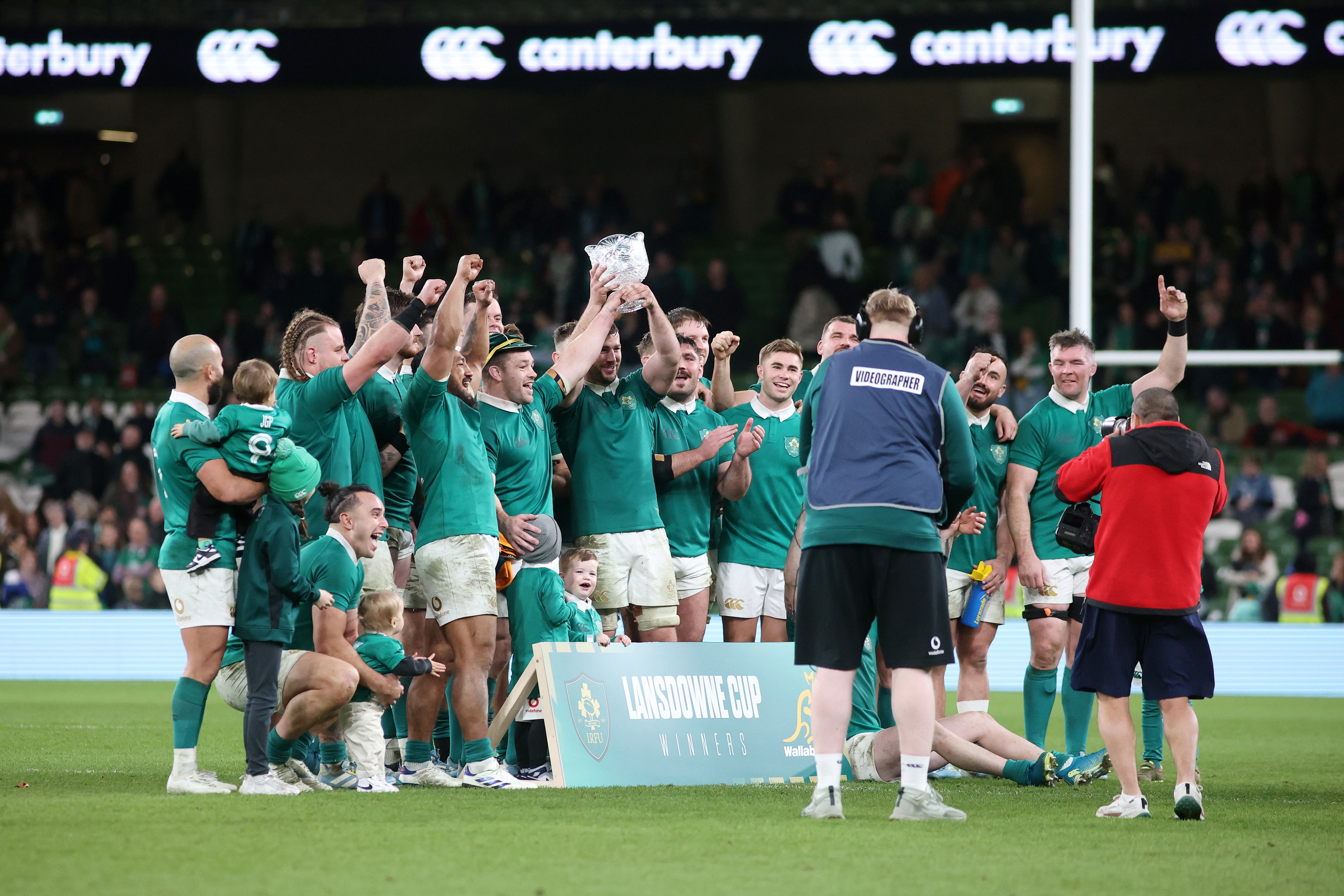 Ireland players lift the Lansdowne Cup following the win over Australia (Evan Treacy/PA)