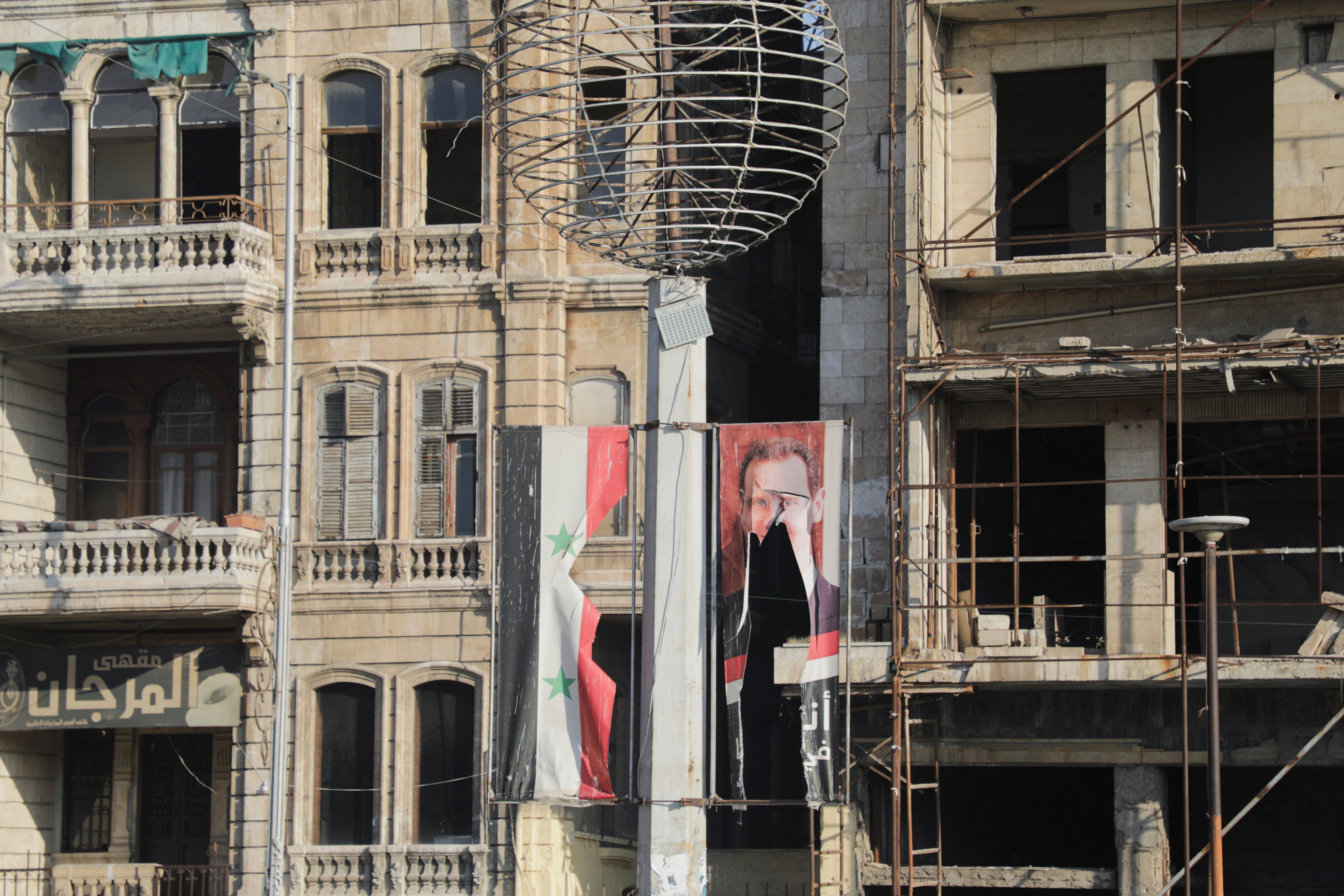 A ripped poster of Syrian dictator Bashar al-Assad was seen in Aleppo