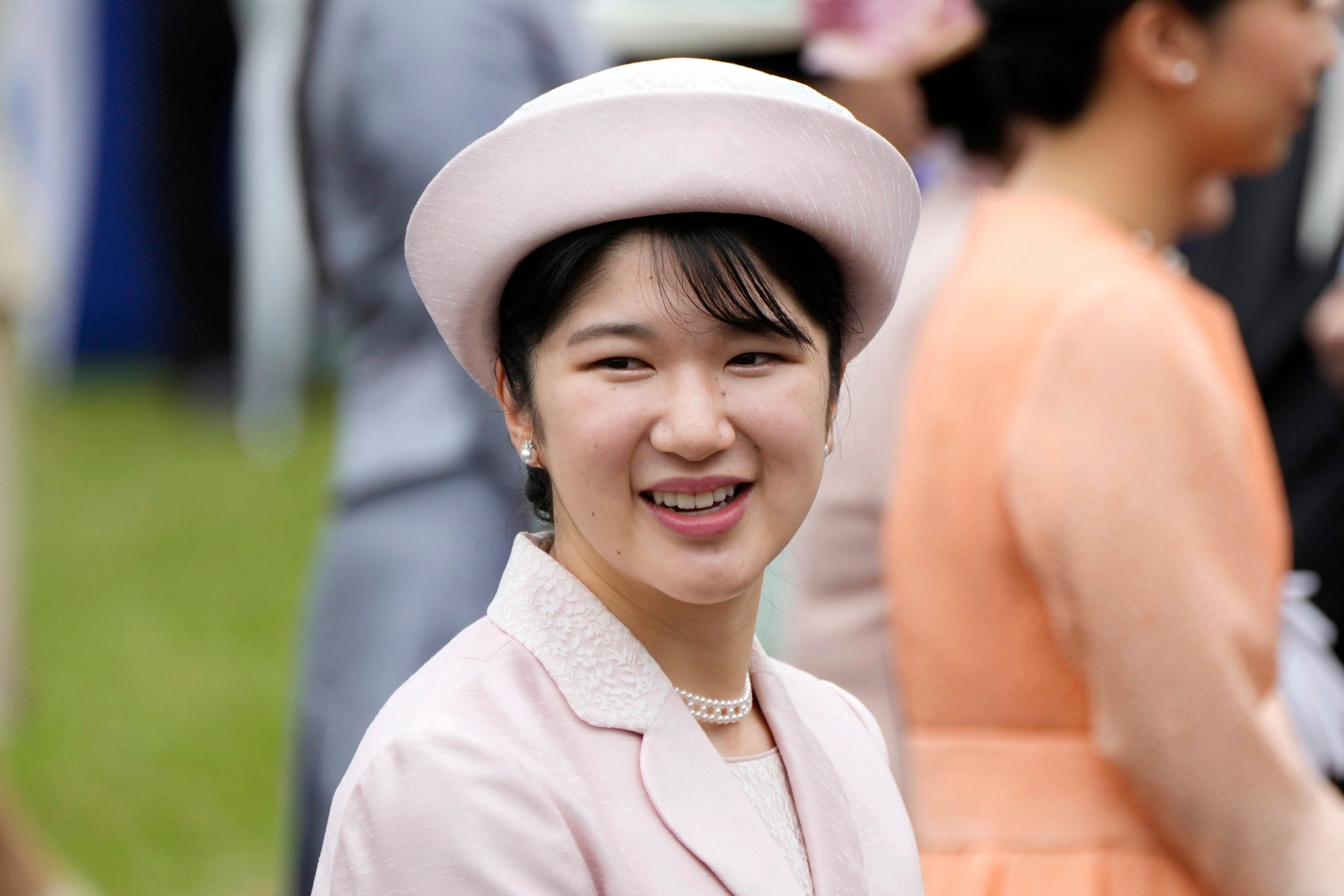 Japan's Princess Aiko greets the guests during a spring garden party at the Akasaka Palace imperial garden in Tokyo, on 23 April 2024