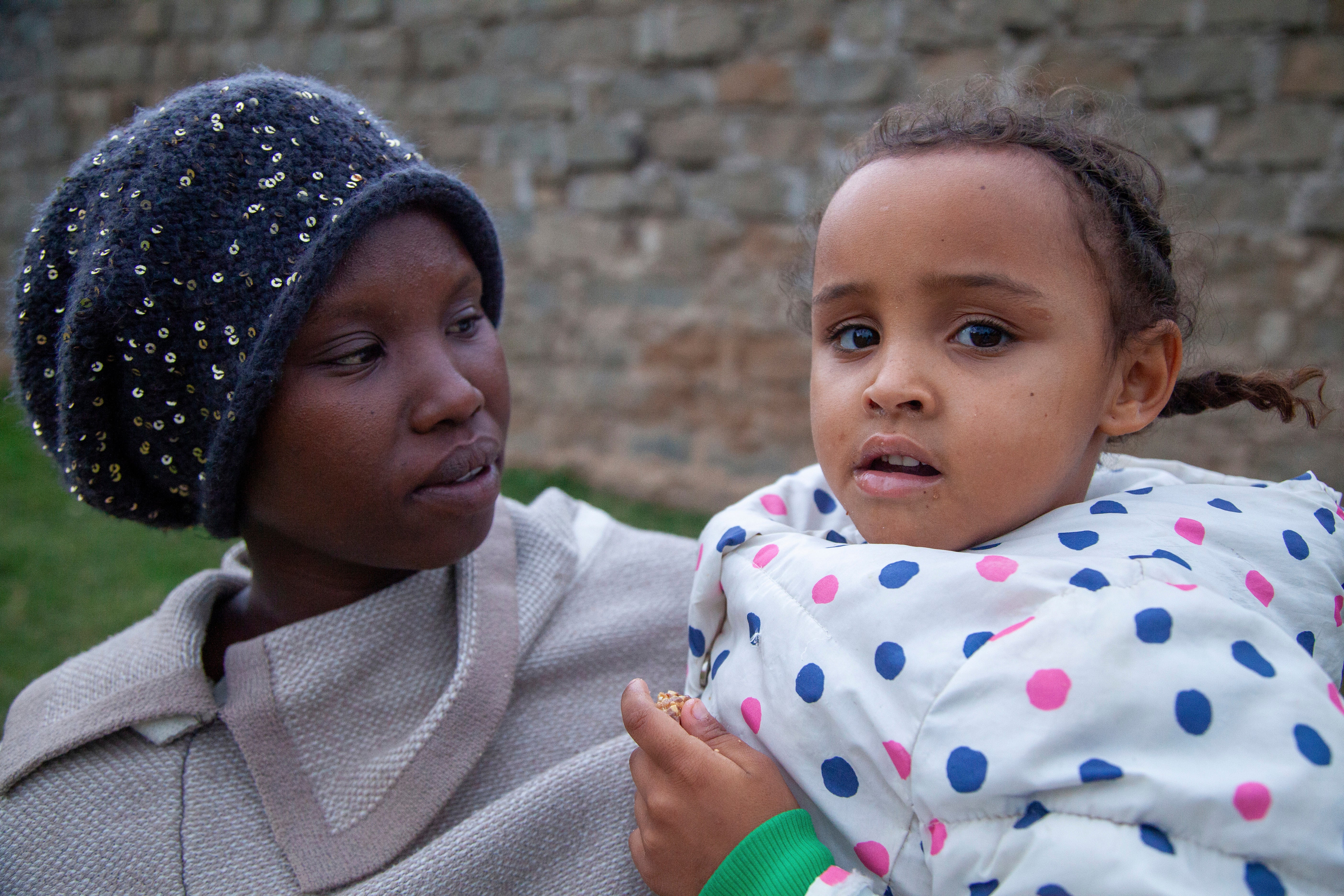 Jenerica Namoru, 29, poses for a photo with her five-year old daughter Nicole, in Nanyuki, Laikipia county, Kenya