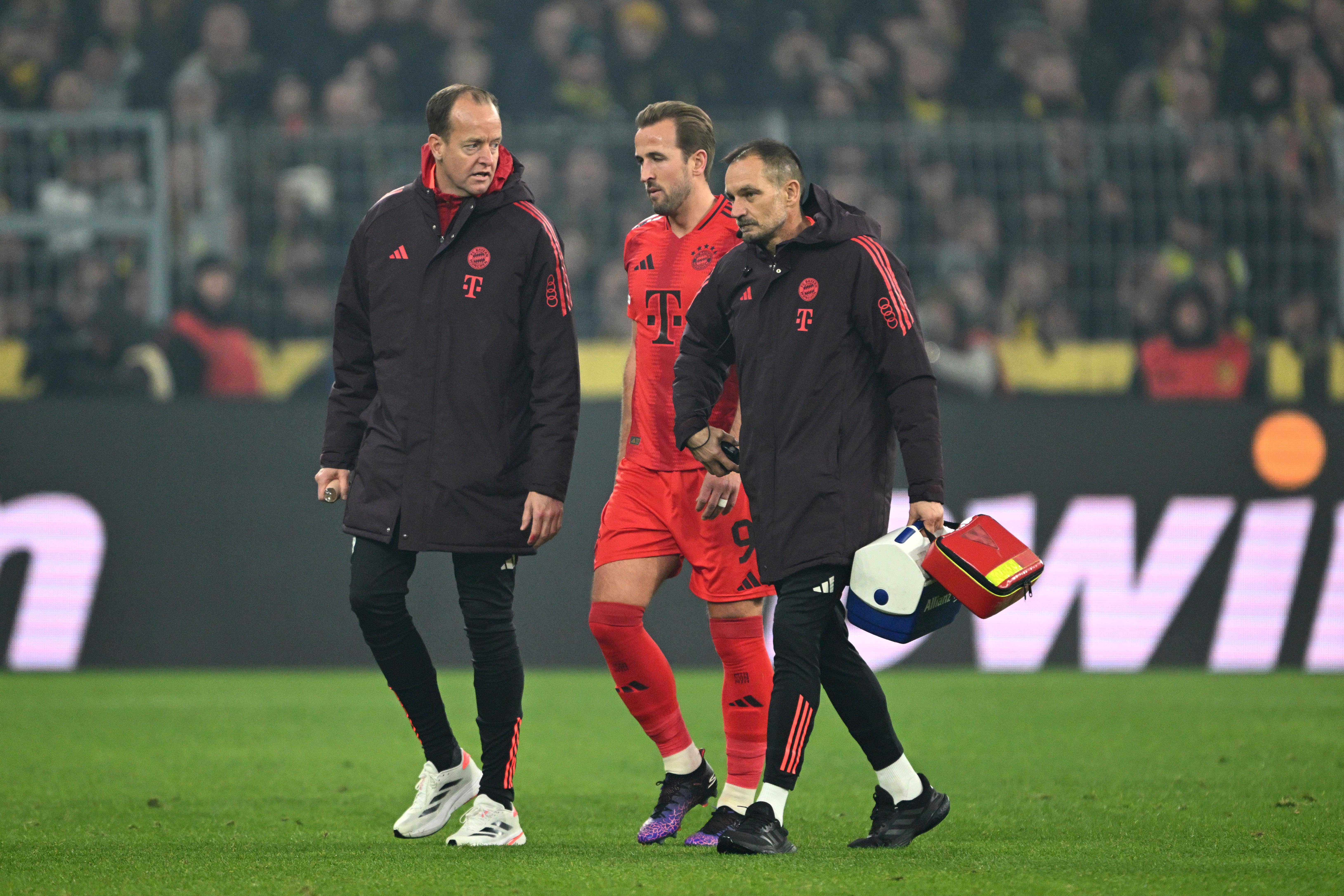 Harry Kane limps off after suffering a hamstring injury against Borussia Dortmund