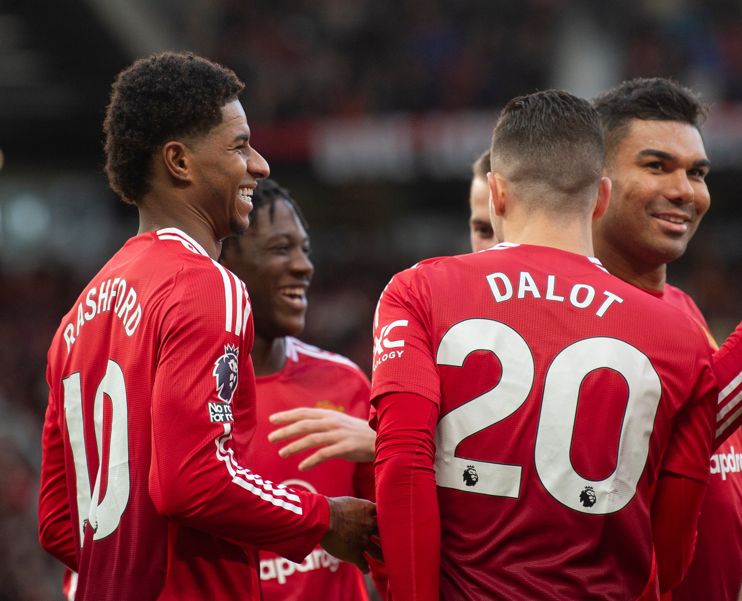 Rashford celebrates after scoring his second against Everton