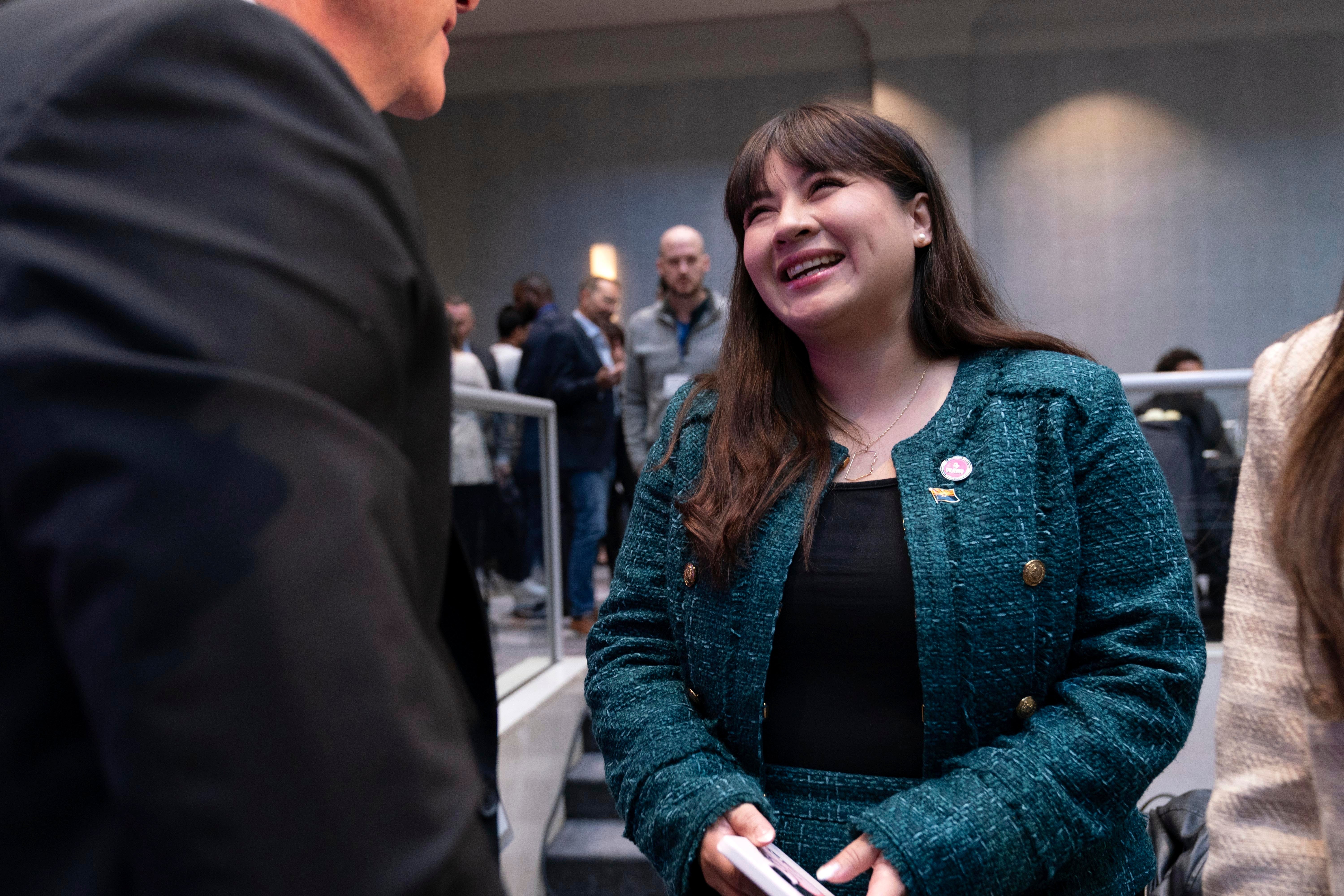 Aliento CEO Reyna Montoya is greeted after speaking at an immigration forum on Capitol Hill. She was one of hte people protected under DACA