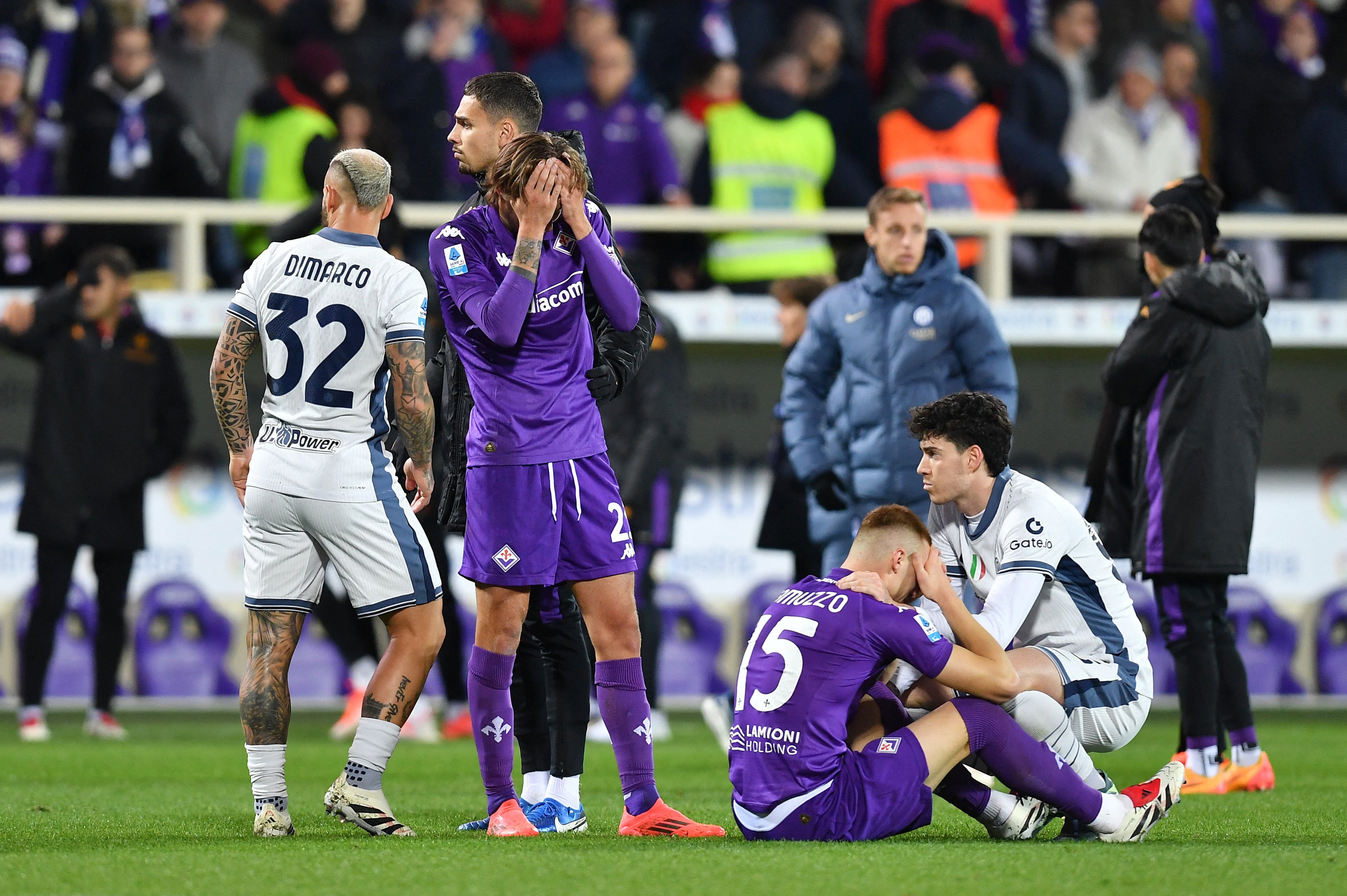 Fiorentina's Andrea Colpani reacts as Edoardo Bove receives medical attention