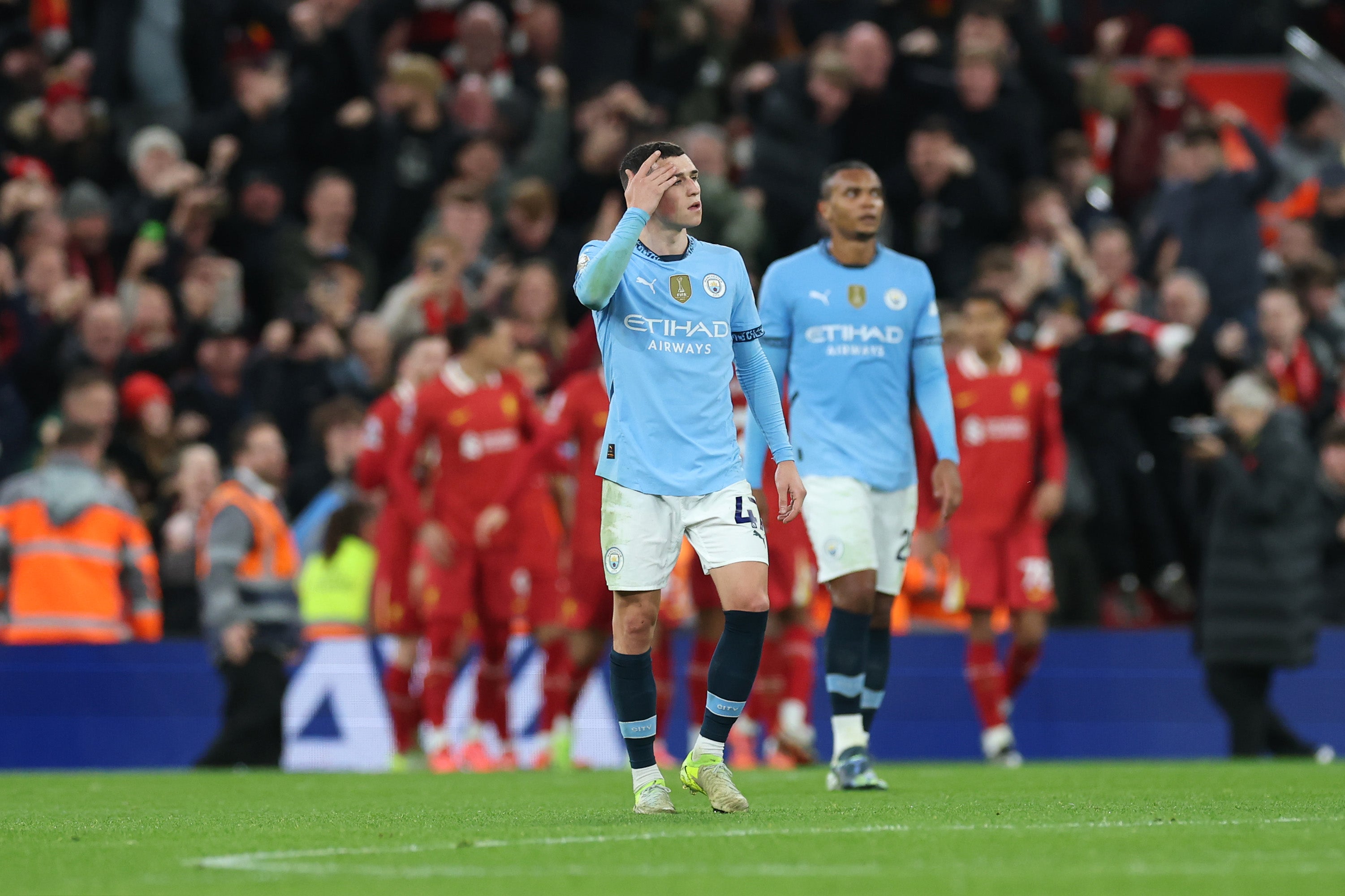 Phil Foden cuts a dejected figure after the champions go 2-0 down