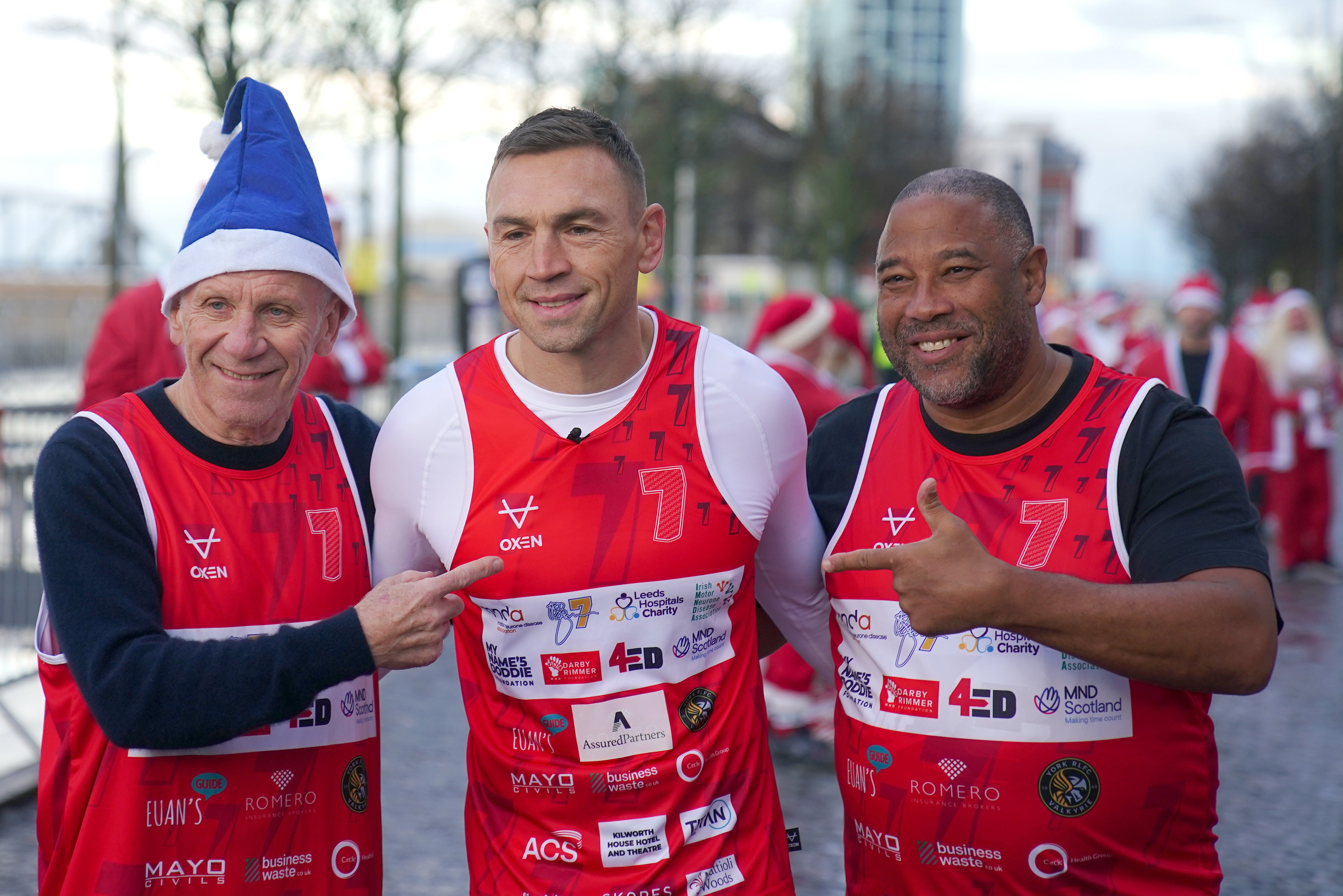 Kevin Sinfield was joined on the start-line by former Everton star Peter Reid (left) and ex-Liverpool winger John Barnes (Peter Byrne/PA)