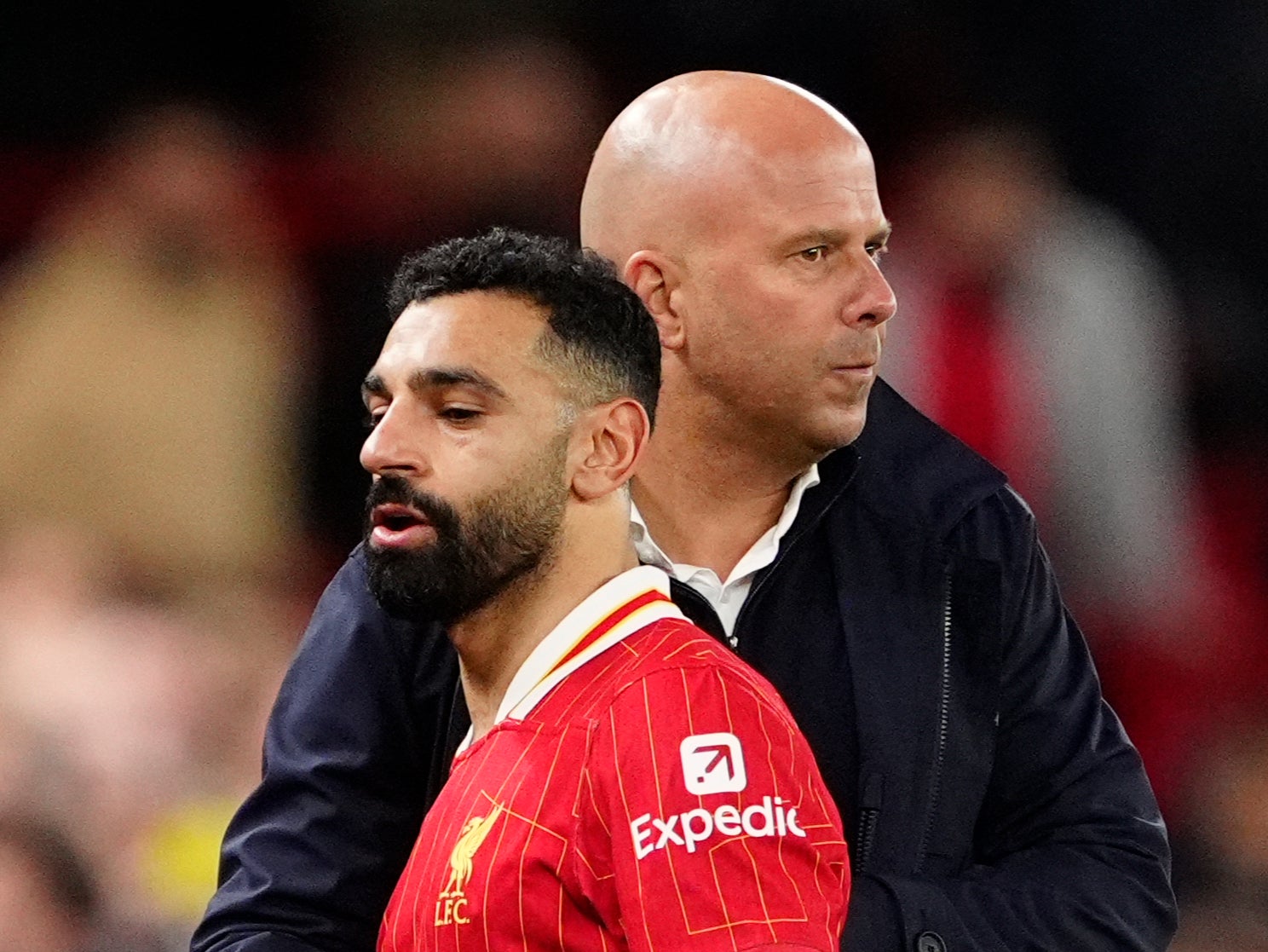 Liverpool manager Arne Slot greets Mohamed Salah against Man City