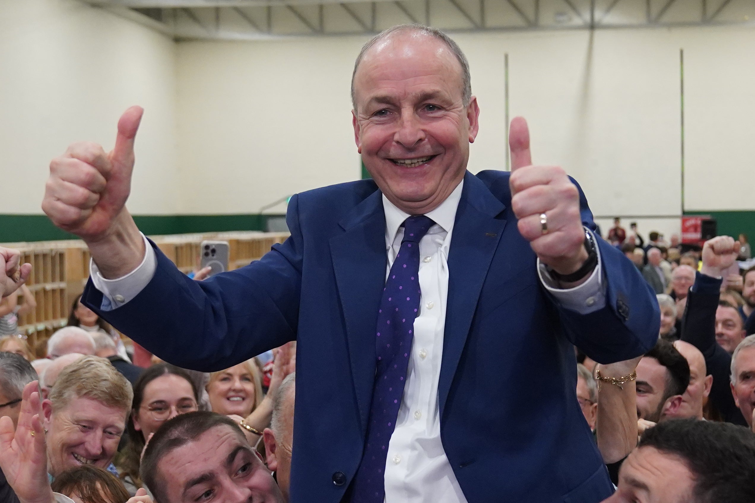 Fianna Fail leader Micheal Martin celebrates his party success during counting at the Irish general election