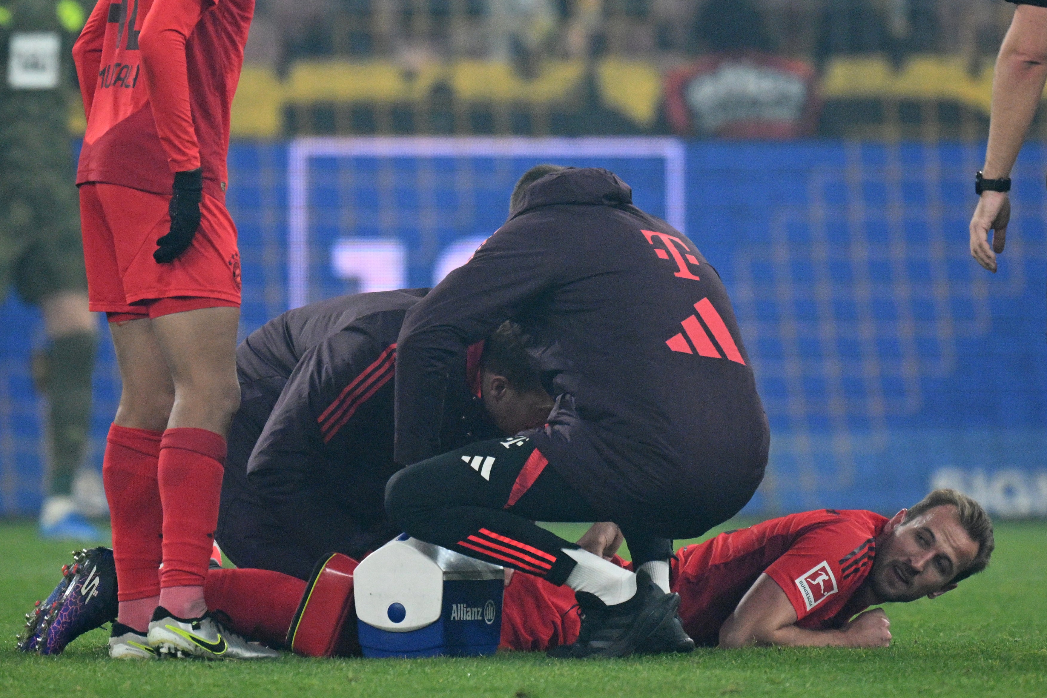 Harry Kane was treated on the pitch during Bayern’s clash with Dortmund