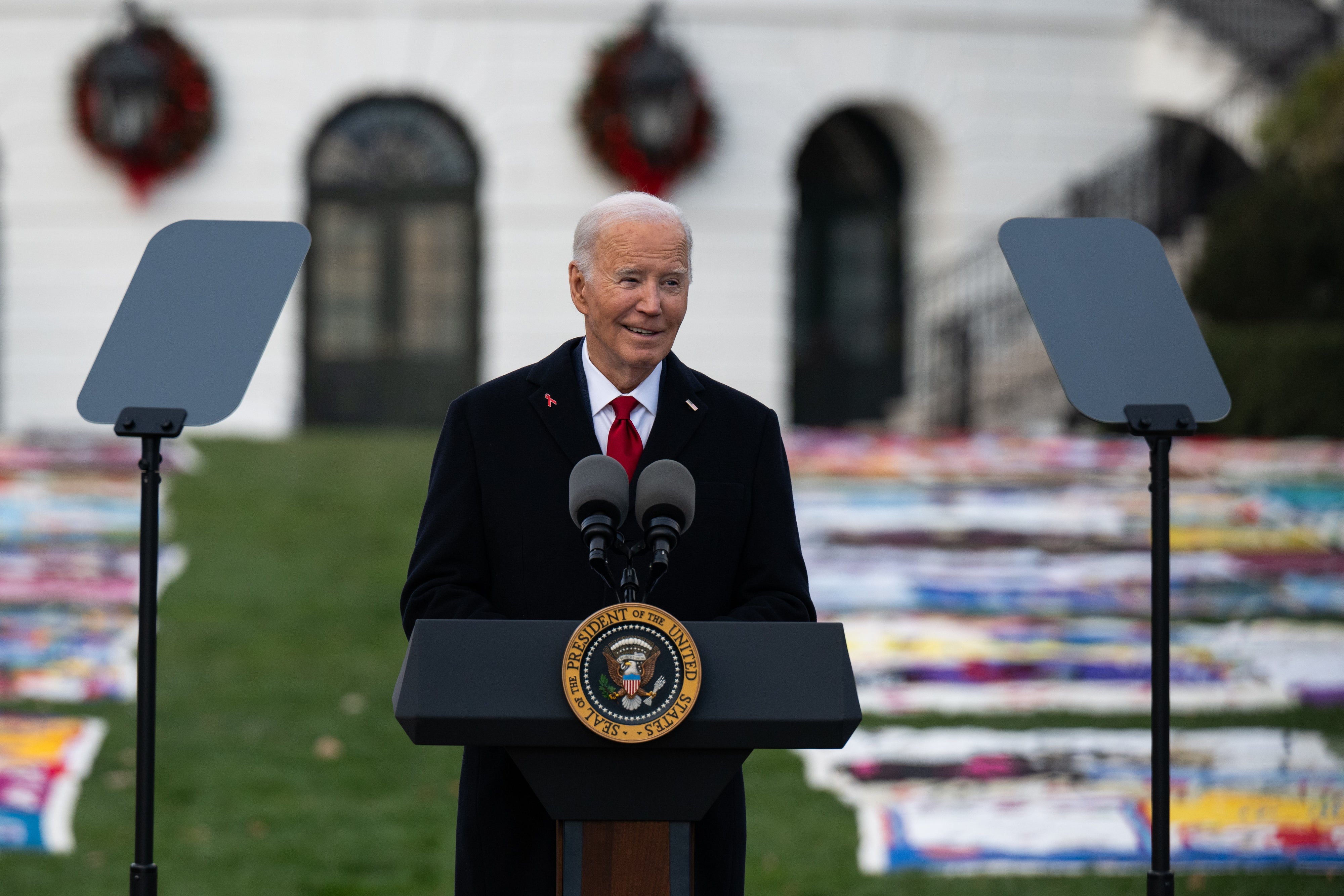 Joe Biden delivers remarks at a World AIDS Day event on the South Lawn at the White House on December 1, 2024 in Washington, DC. Some White House staffers are frustrated as they possibly might not get their departure photos with the president