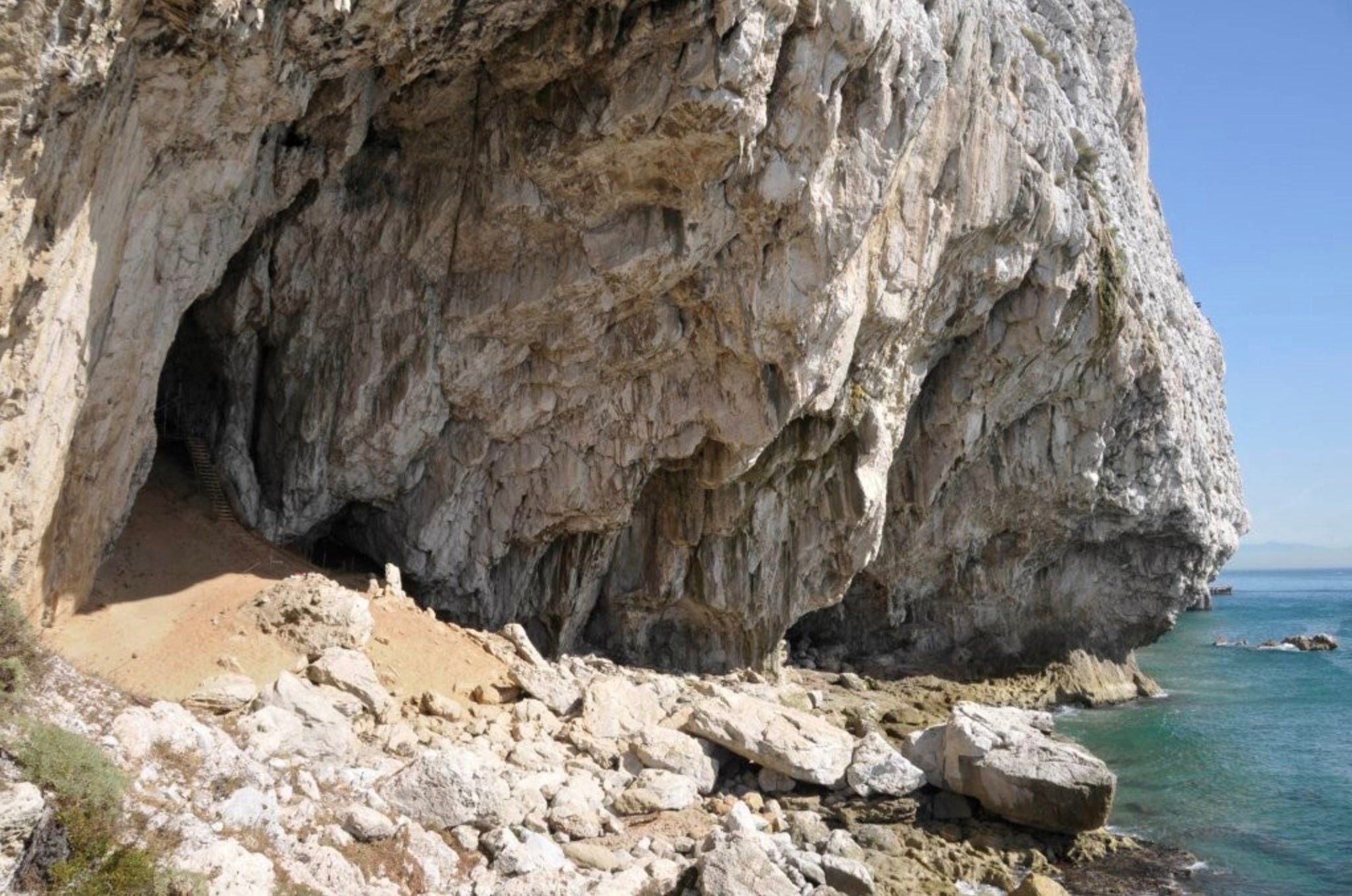 Archaeologists have uncovered a structure that was used by Neanderthals in present-day Gibraltar tens of thousands of years ago, including a pit dug into the ground at the seaside Vanguard Cave