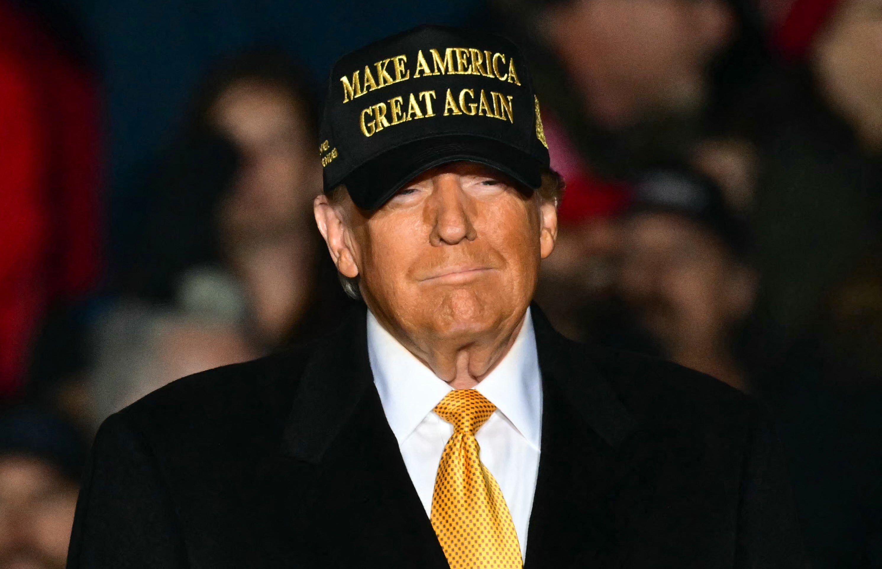 Former US President Republican presidential candidate Donald Trump arrive to a campaign rally in Traverse City, Michigan on October 25, 2024.