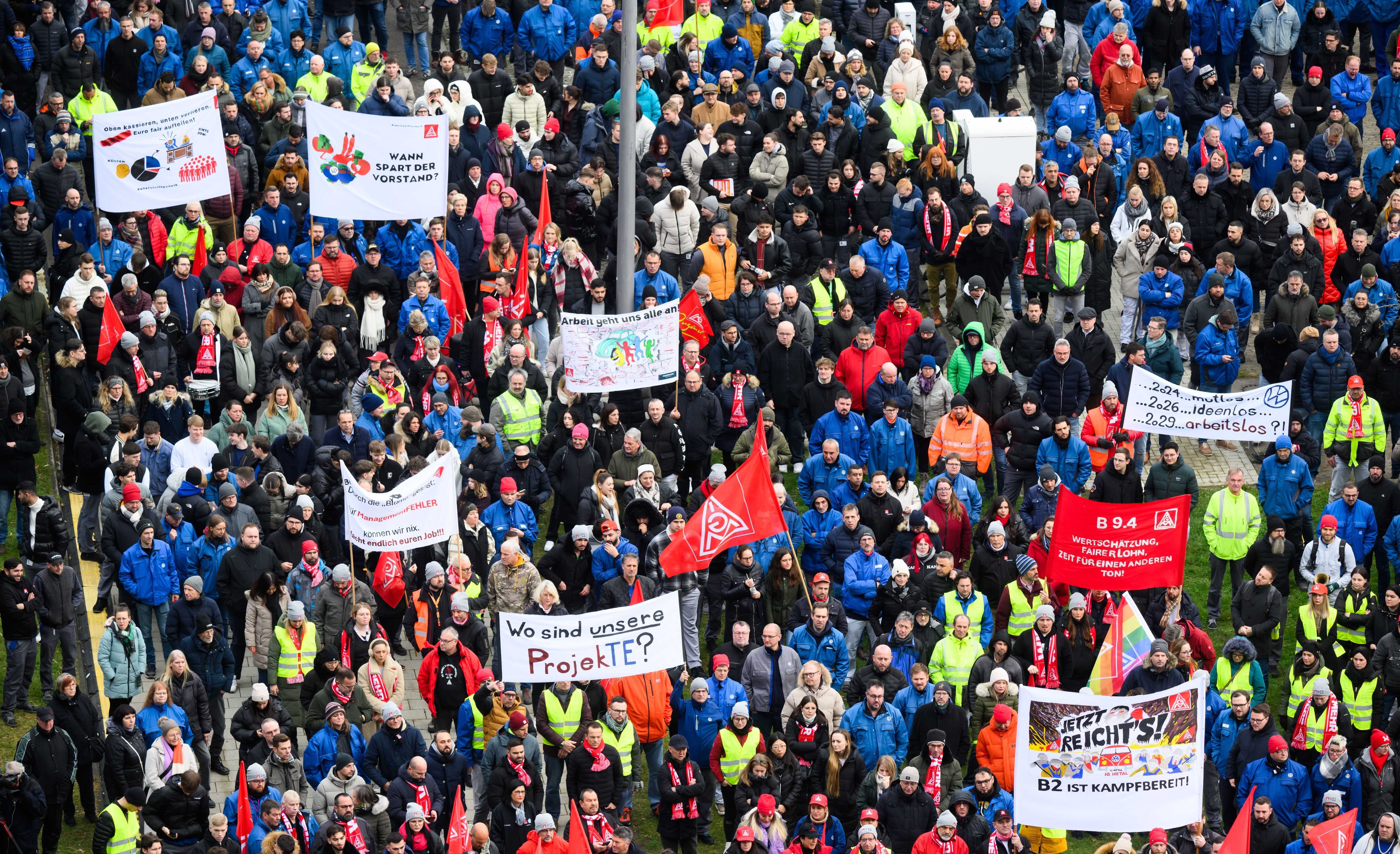 Volkswagen employees attend a strike rally on the premises of the Volkswagen (VW) main plant in Wolfsburg, Germany