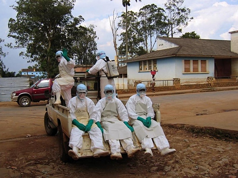 Health workers in protective suits respond to a previous Marburg virus outbreak in Angola in April 2005