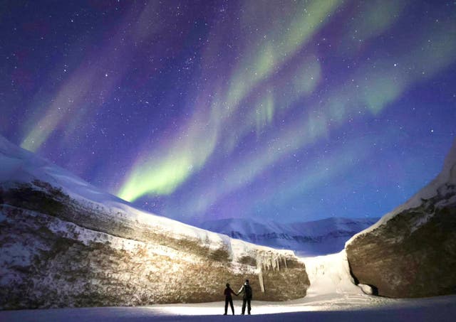 <p>Bryony and Henrik Hegard looking up at the Northern Lights
</p>