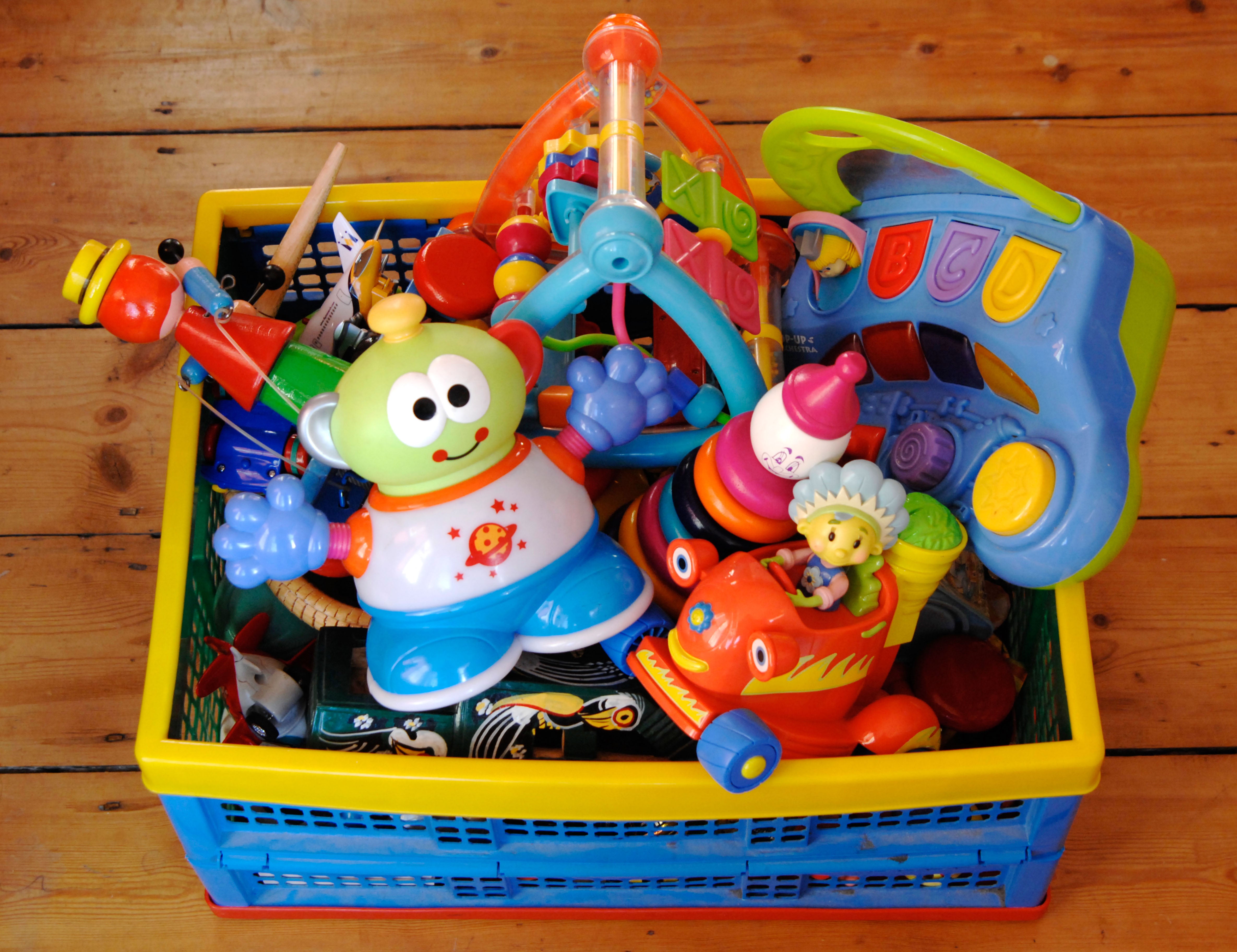 A crate of colourful plastic children’s toys