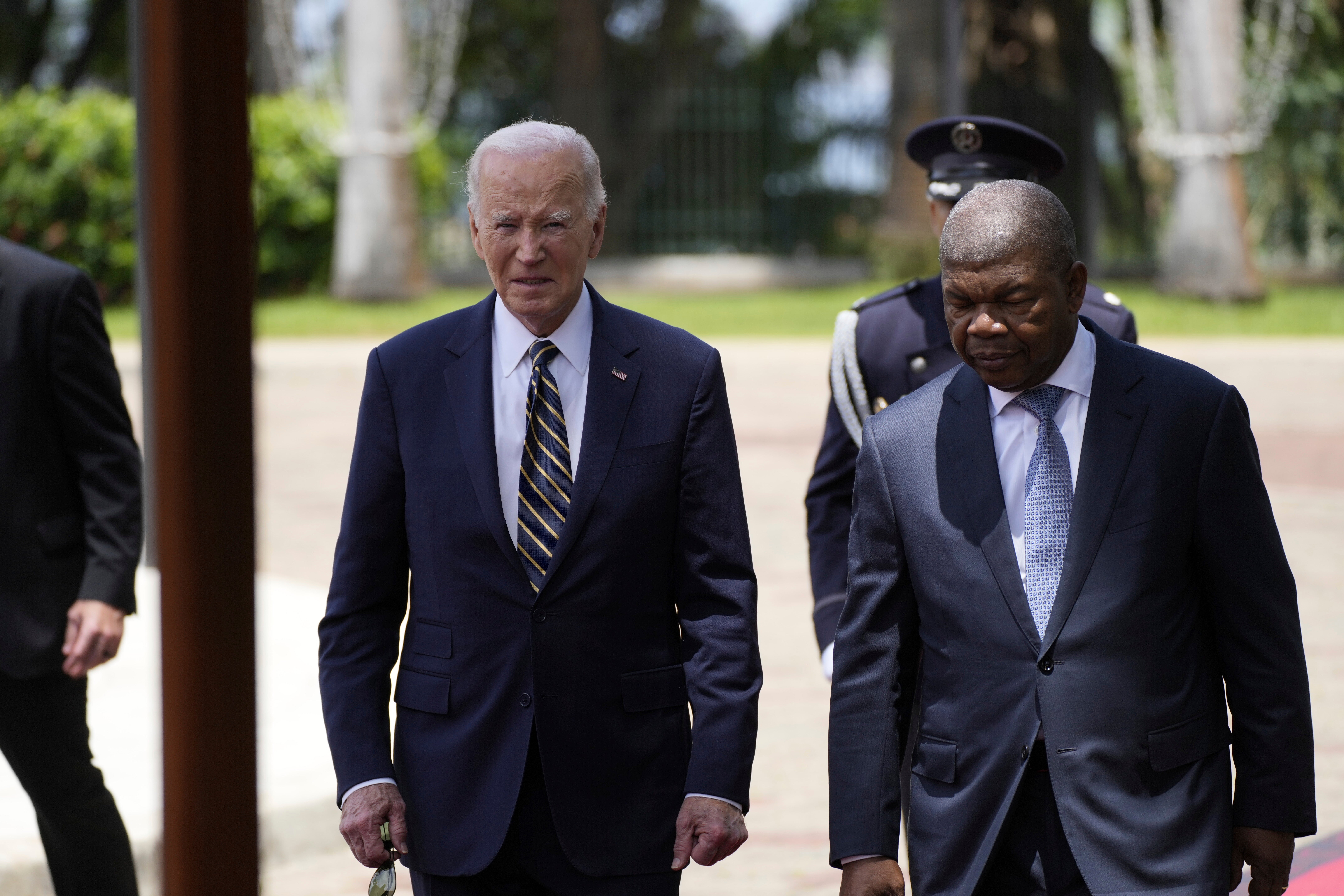 President Joe Biden walks with Angola’s President Joao Lourenco, at the presidential palace in the capital Luanda on December 3, 2024