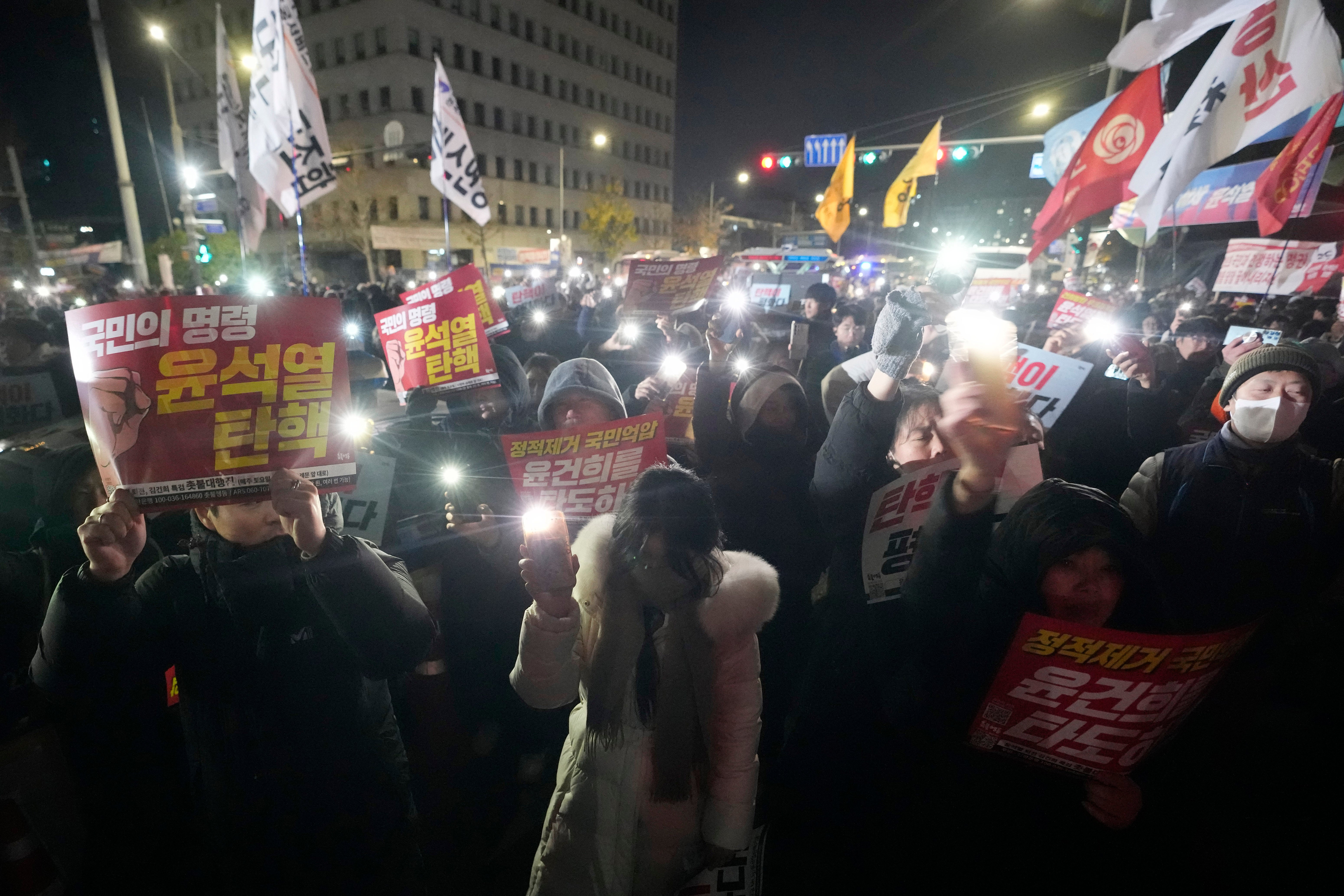 People gather to demand South Korean President Yoon Suk Yeol to step down in front of the National Assembly in Seoul, South Korea,