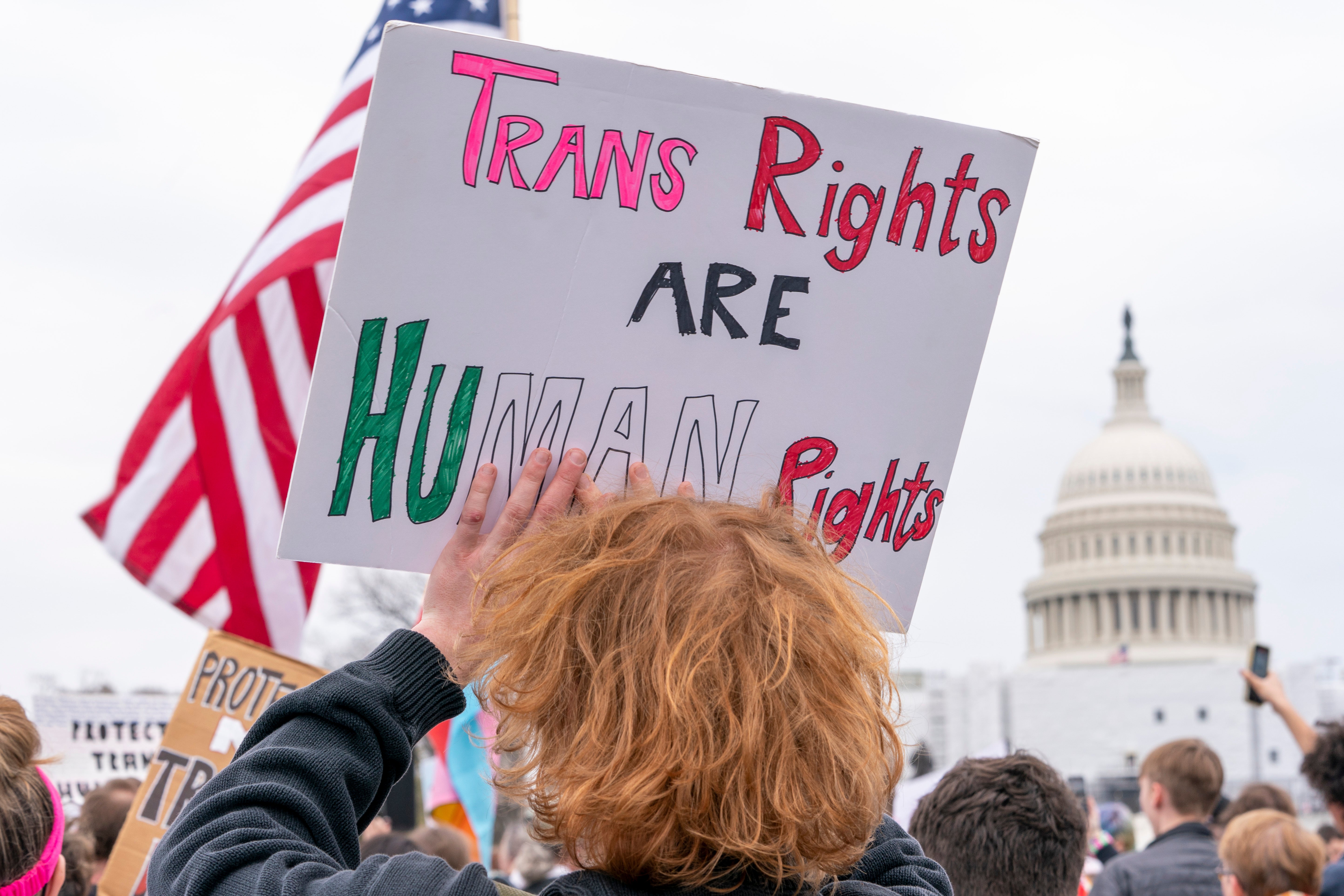 Demonstrators march in Washington, D.C., to support transgender rights. A groundbreaking Supreme Court case could decide whether bans on gender-affirming care for minors are unconstitutional