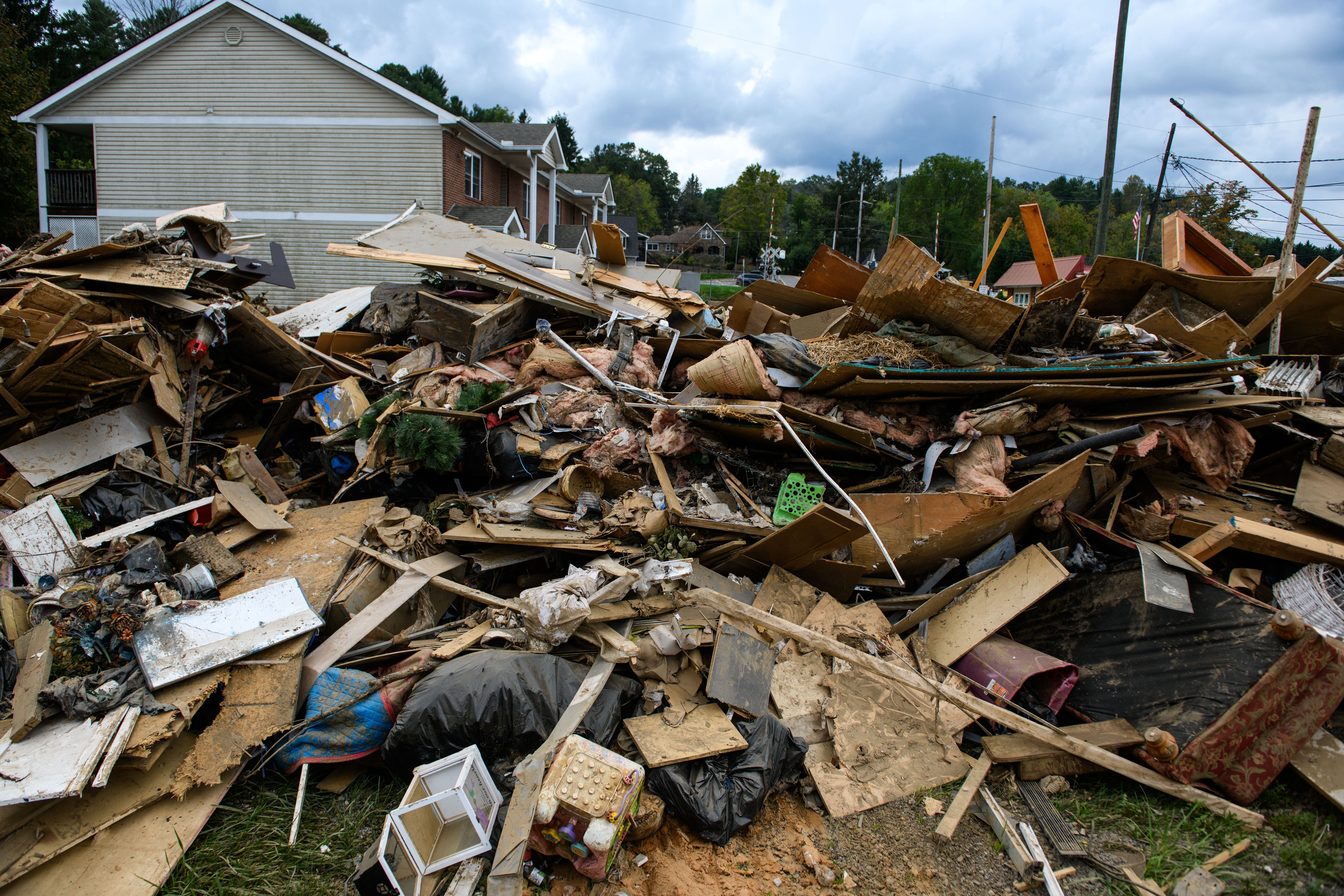 A pile of damaged belongings and debris is seen in Clyde, North Carolina, in early October. Debris from the storm included trees, plastic, and other objects