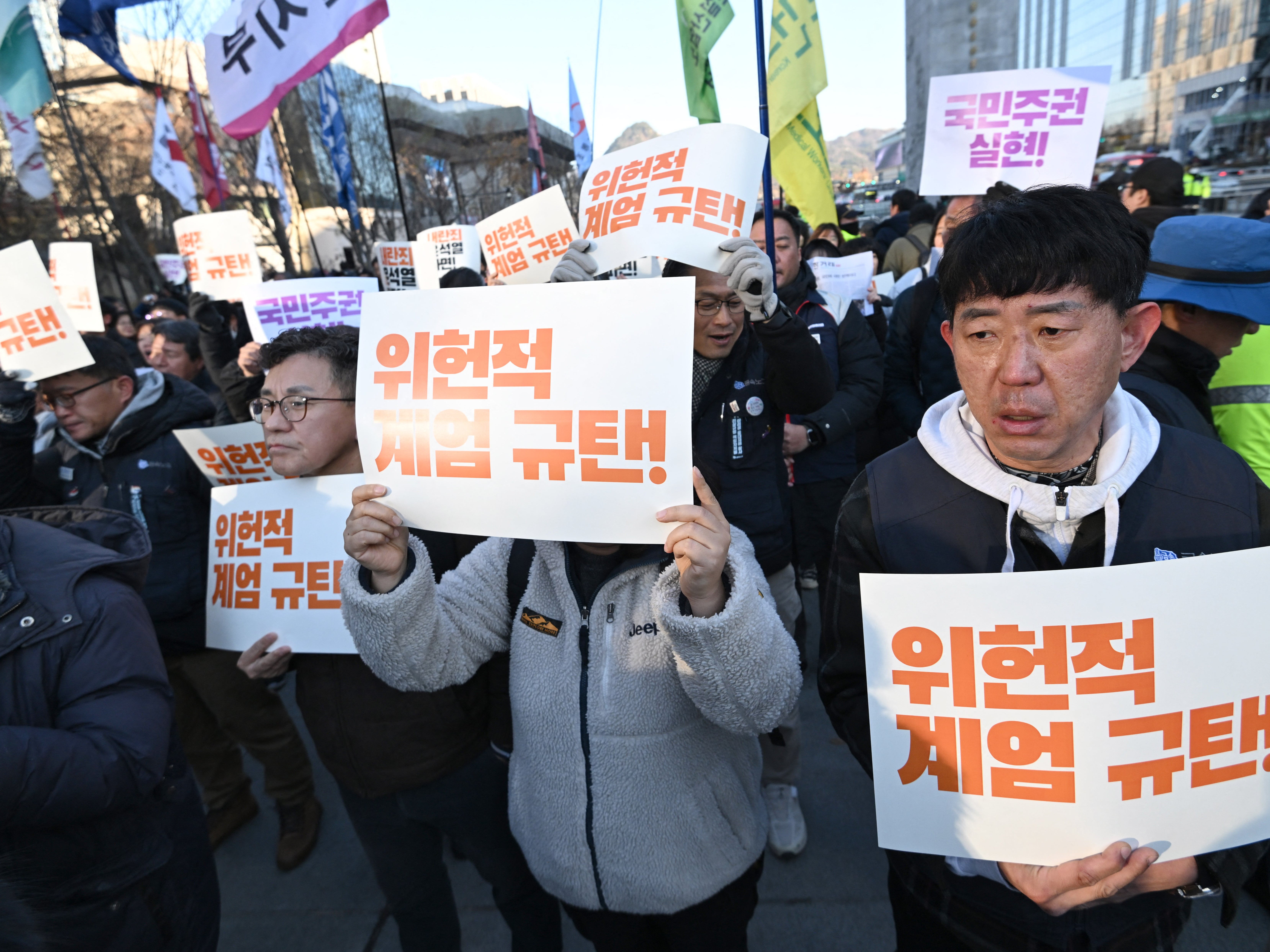Protests in South Korea as lawmakers call for President Yoon’s resignation after martial law lifted: Live