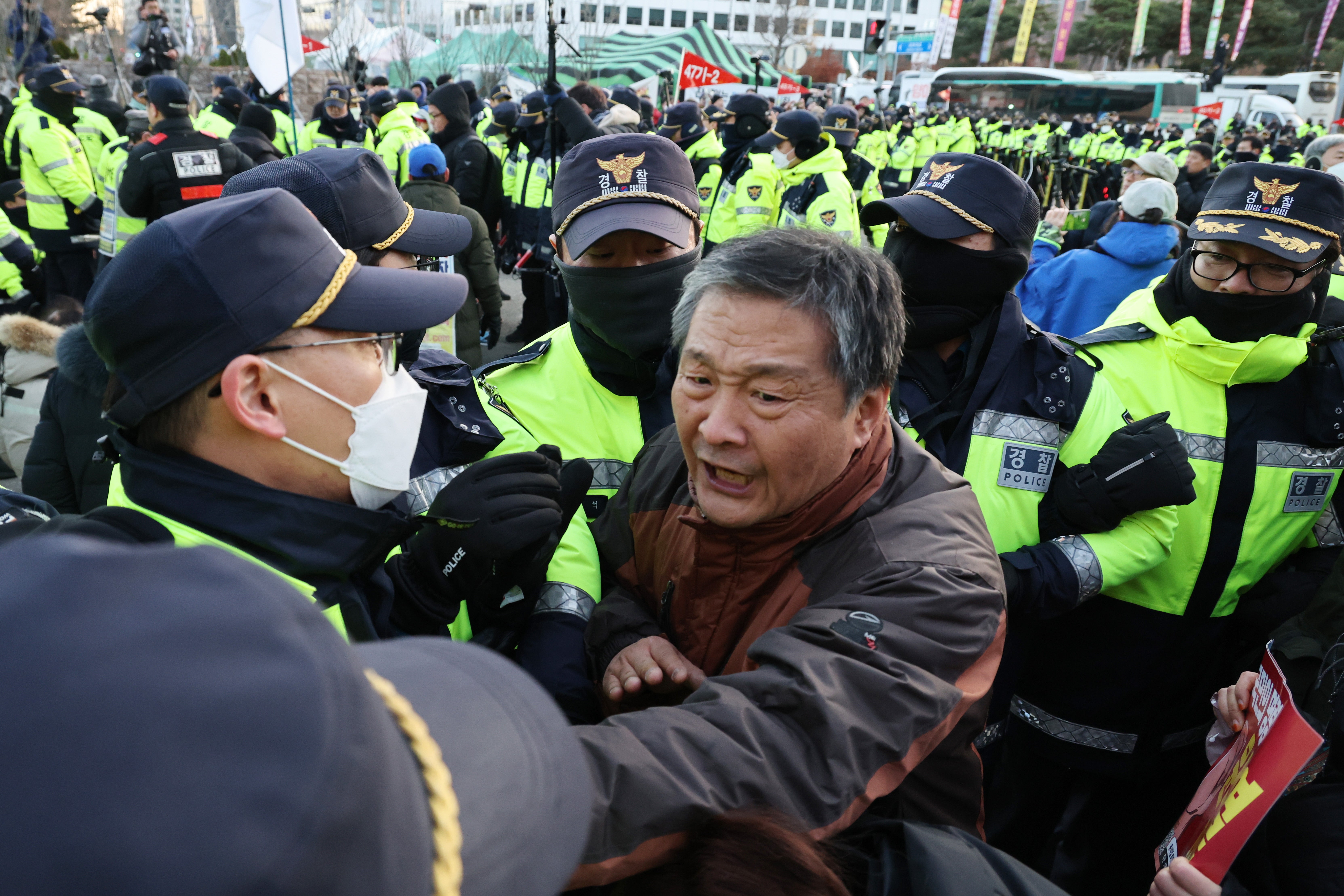 Protesters clash with police during a demonstration calling for the resignation and impeachment of South Korean president Yoon Suk Yeol