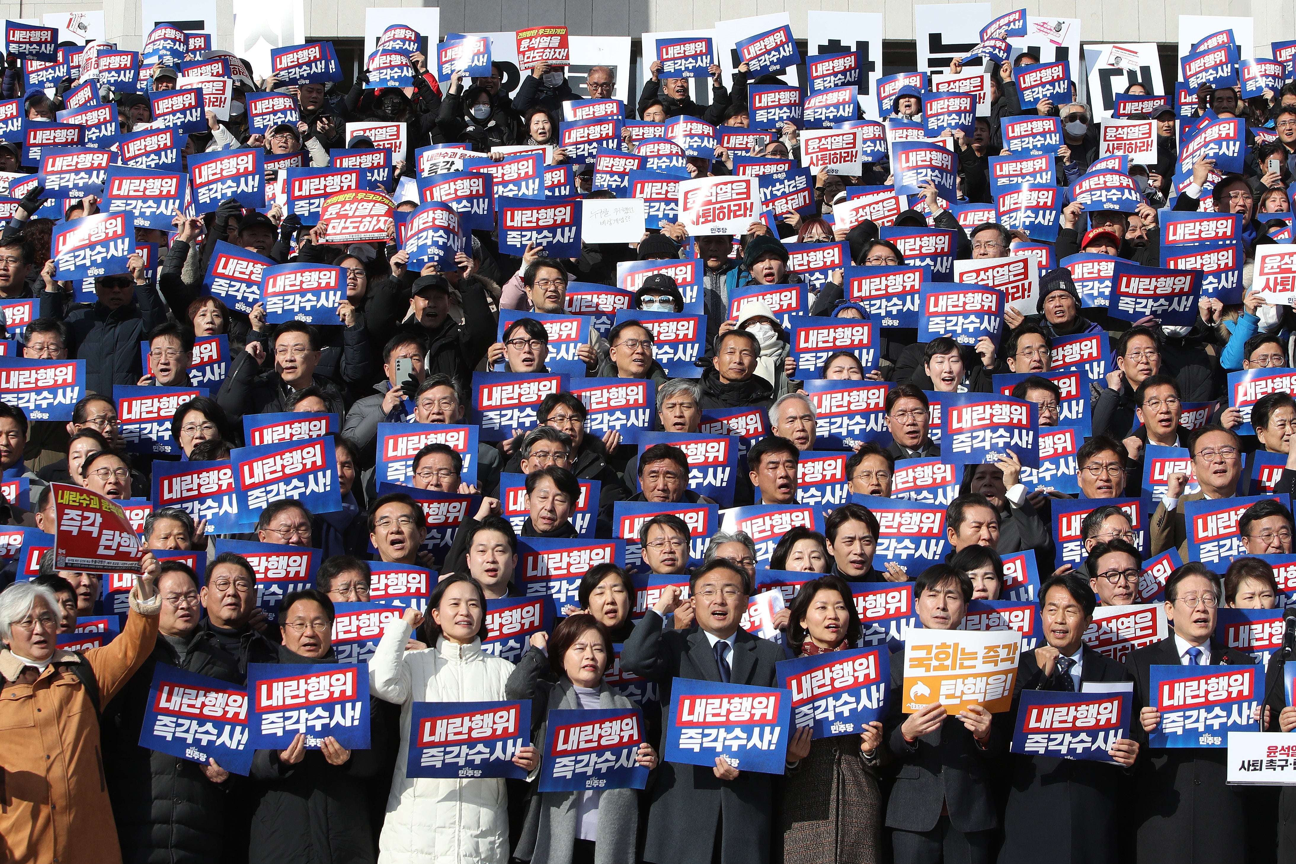 Supporters of South Korea’s main opposition Democratic Party demonstrate against the president at the National Assembly on 4 December 2024